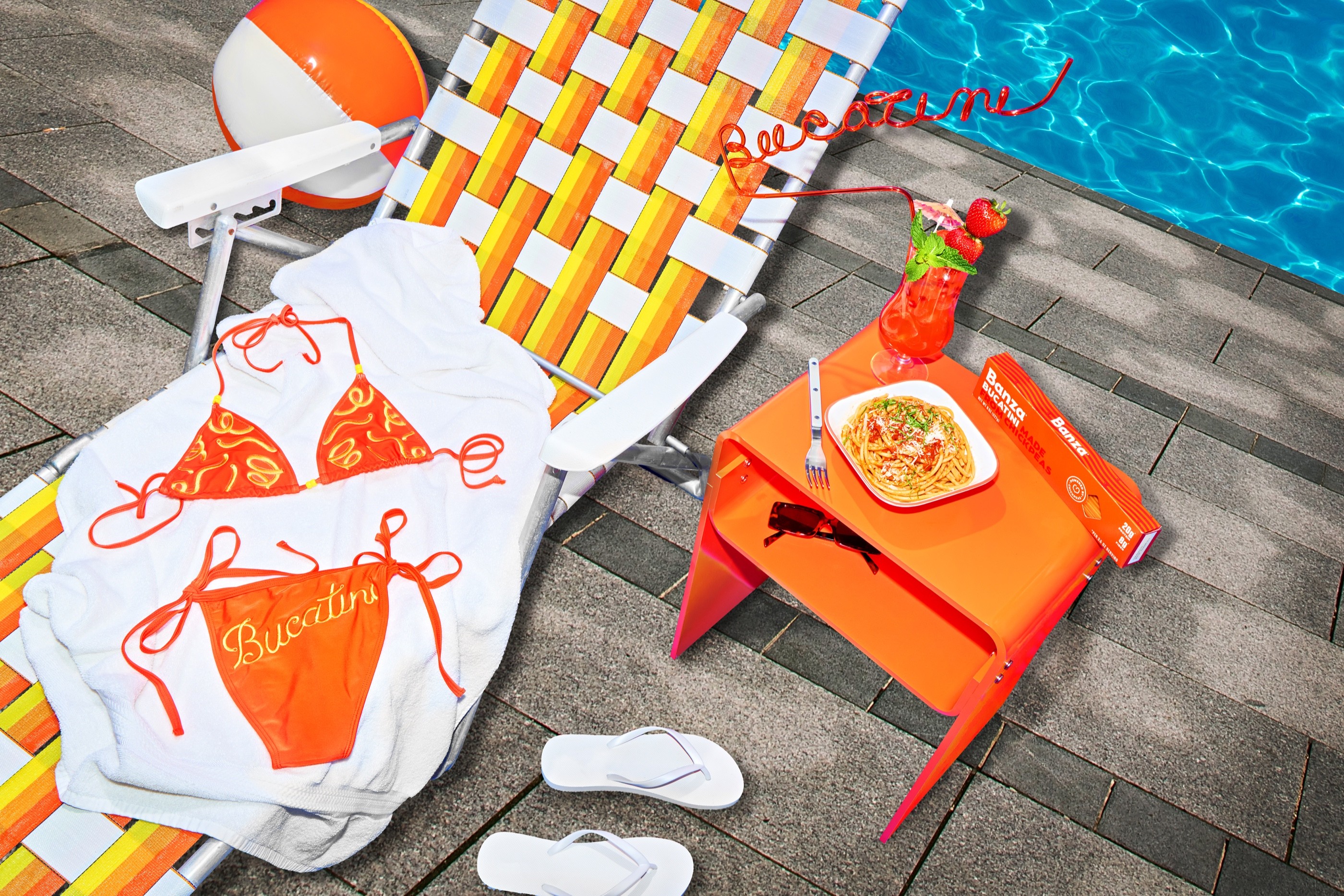 Banza Bucakini swimsuit and poolside pasta still life
