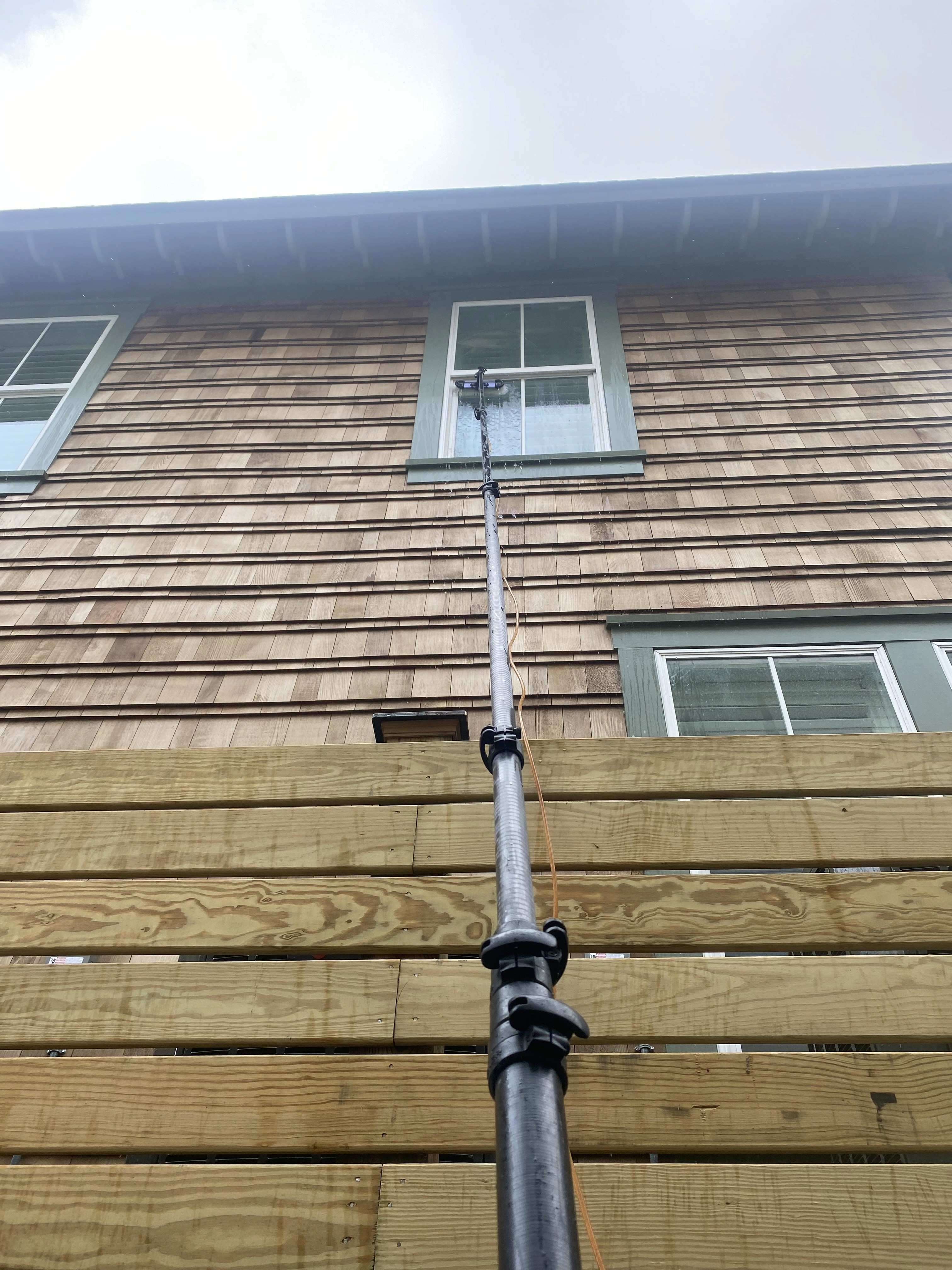 Close-up of dirty, streaked window showing need for professional cleaning.