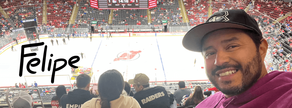Image of Felipe Caro, illustrator from Inky Thinking watching an ice hockey match in New York