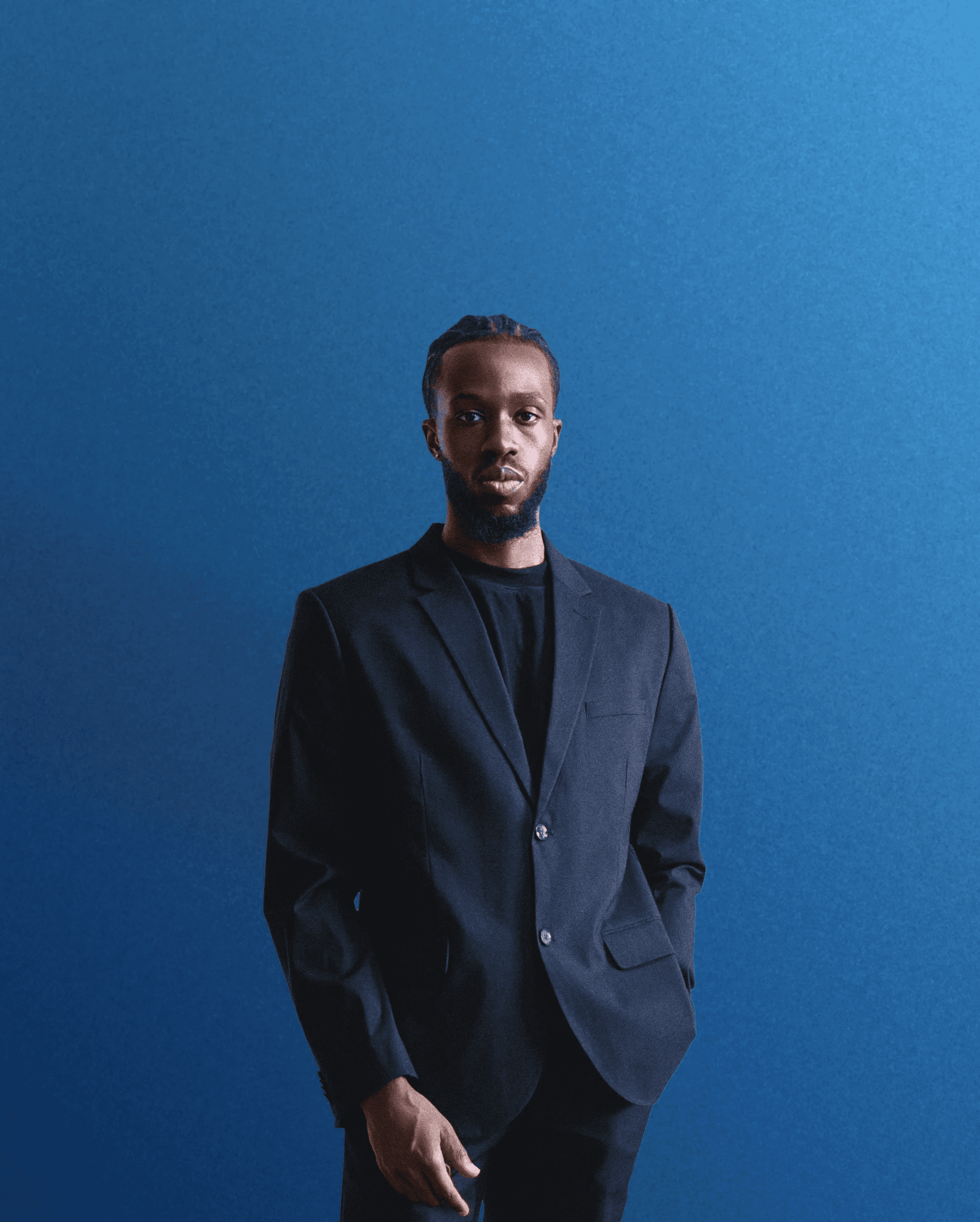 man standing beside wall