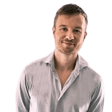 man wearing black crew-neck shirt and black cap in front of glass wall