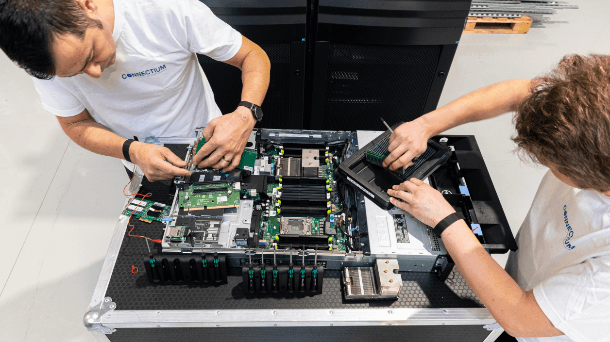 Connectium engineers carrying out a data centre audit on server equipment