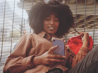 Woman using whatsapp on her phone