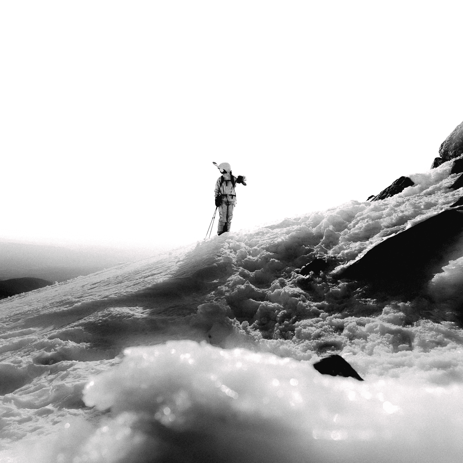 skier walking up the mountain.