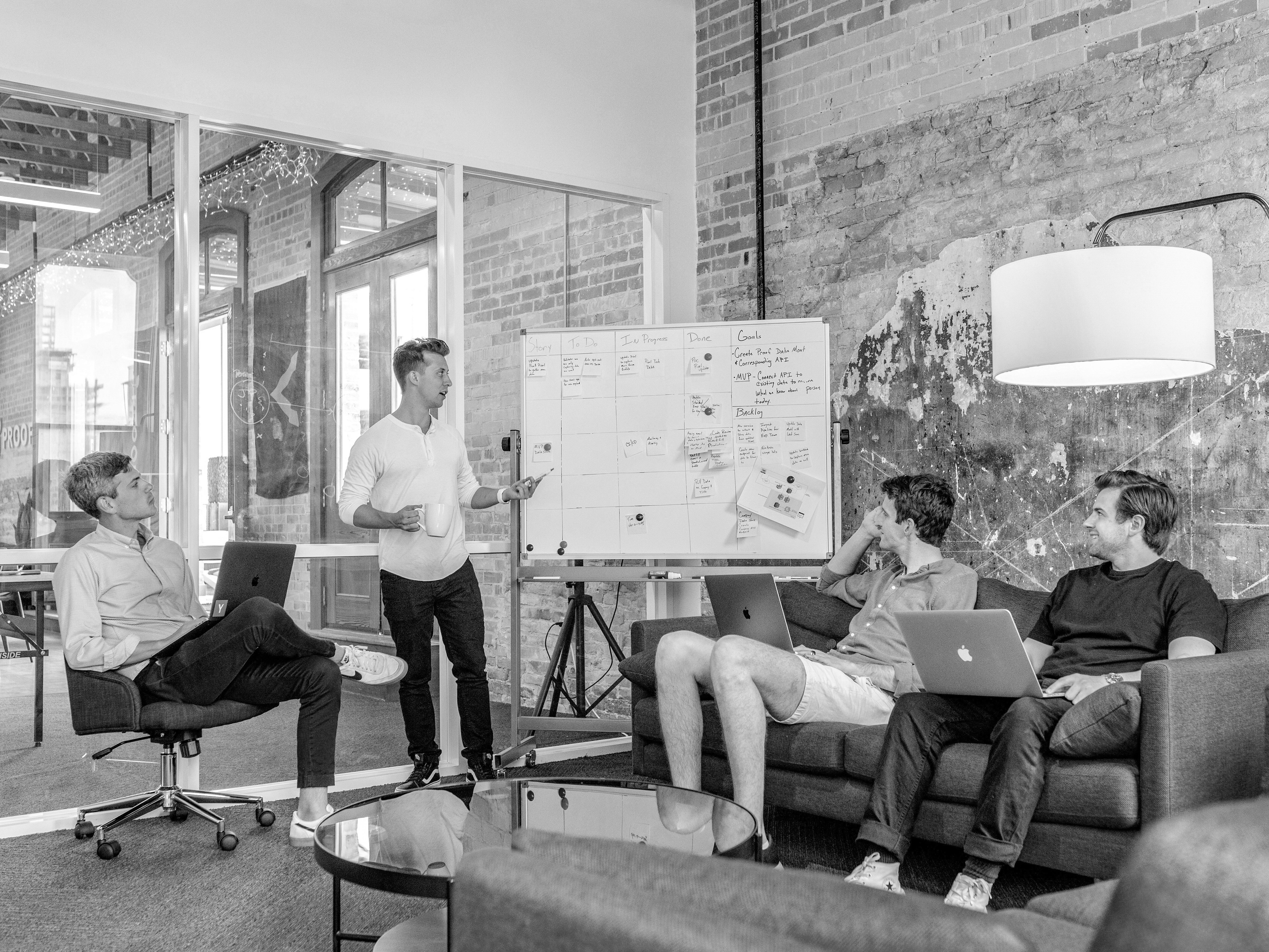 person sitting in a chair in front of a man