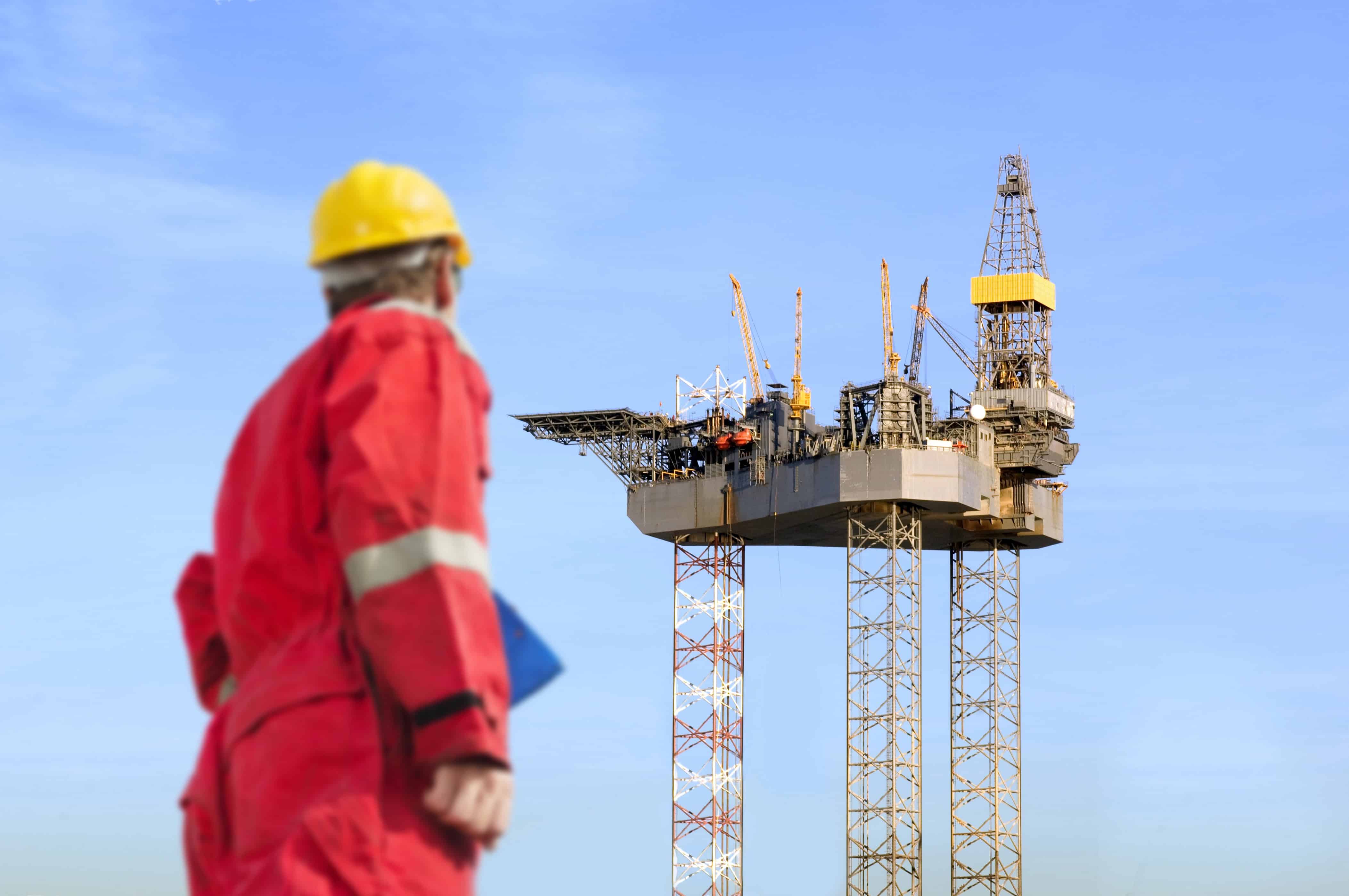 Jackup drilling rig being overseen by safety leader to ensure safe conditions of crew onboard