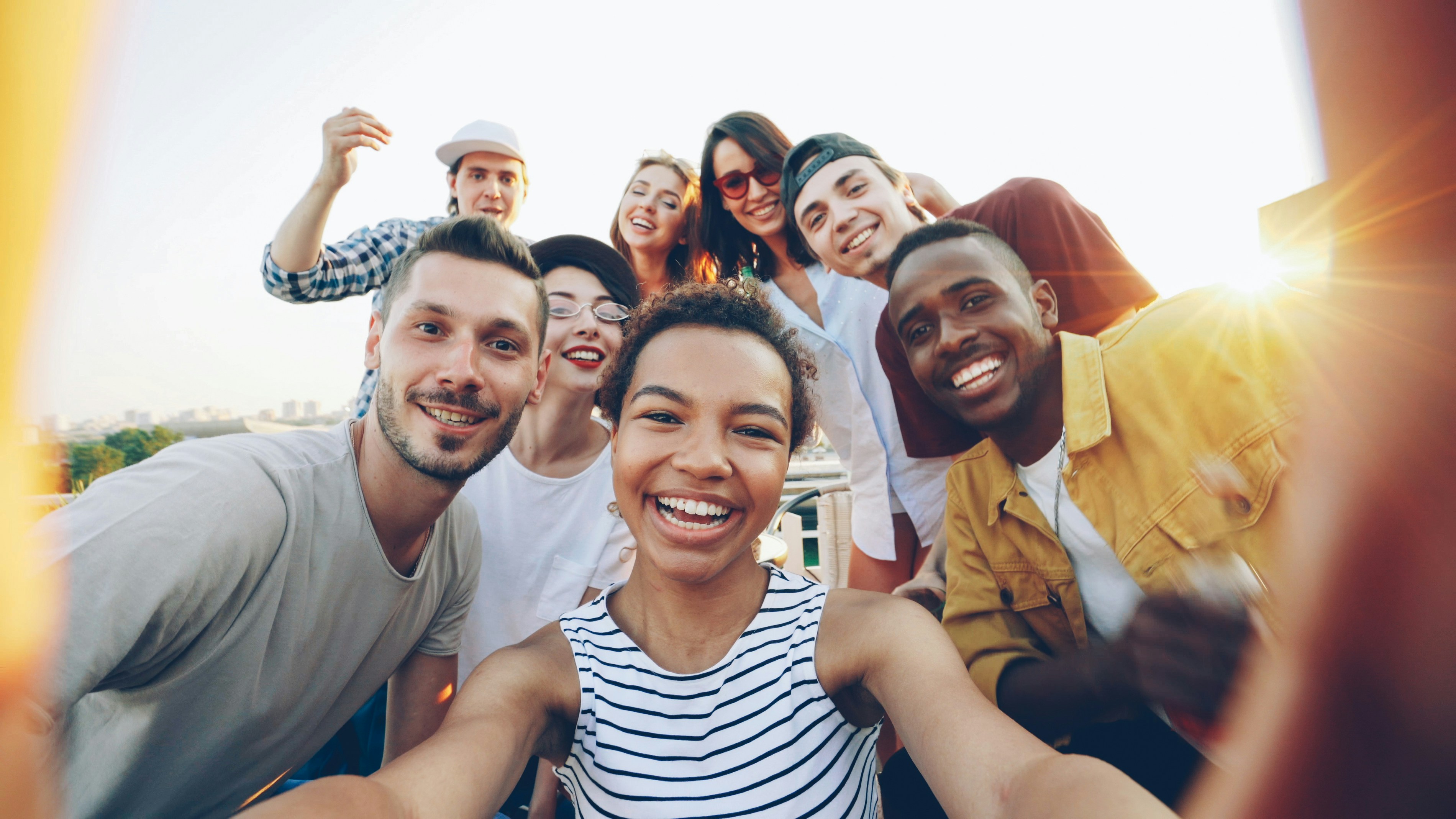 Diverse group of friends taking a selfie outdoors selfie