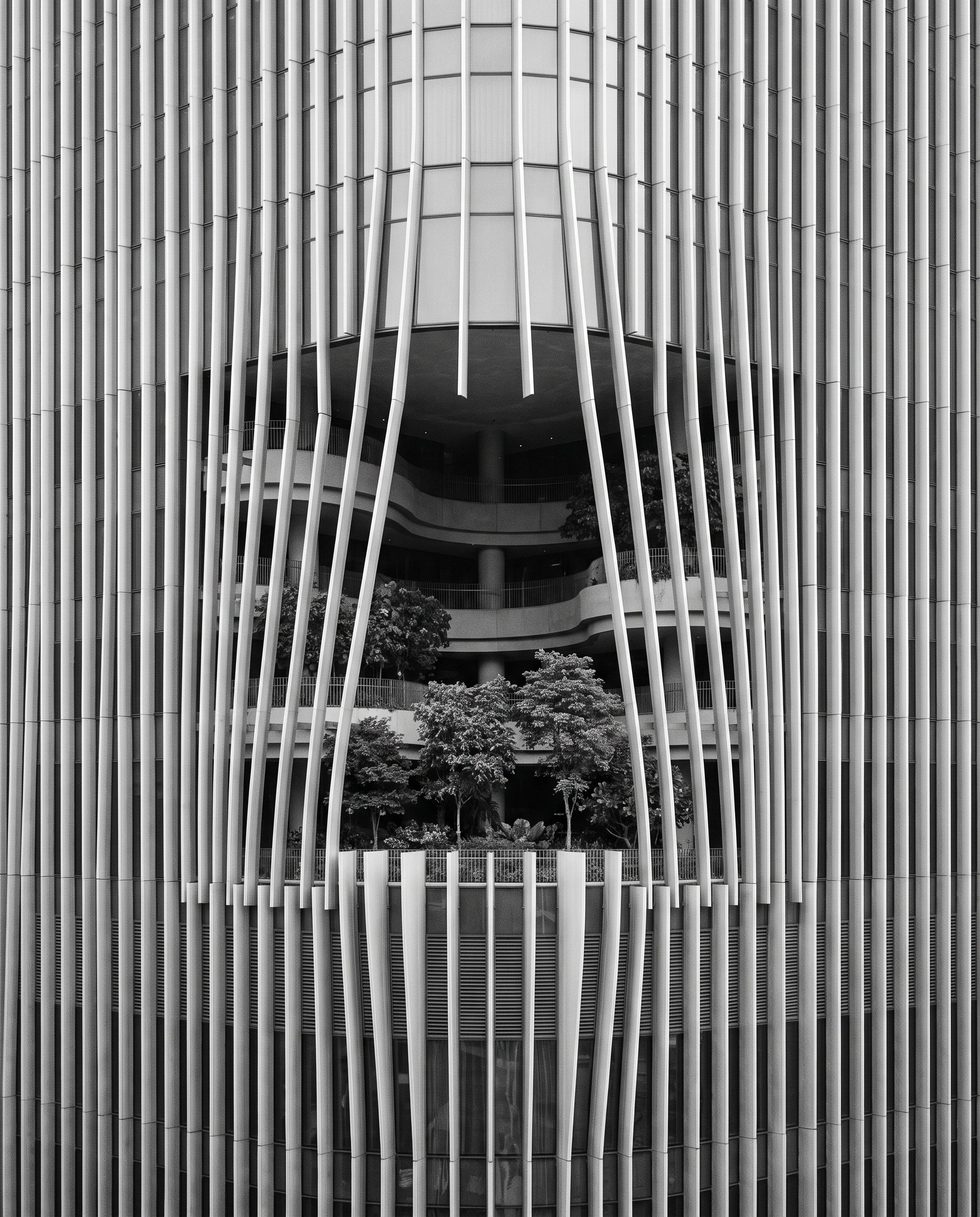CapitaSpring tower, Raffles Place, Singapore, with its mid-tower garden, black and white