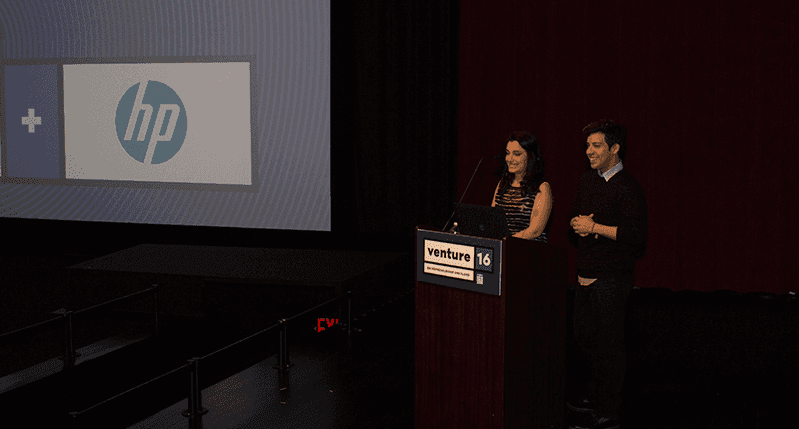 two people giving a speech in the venture 16 event