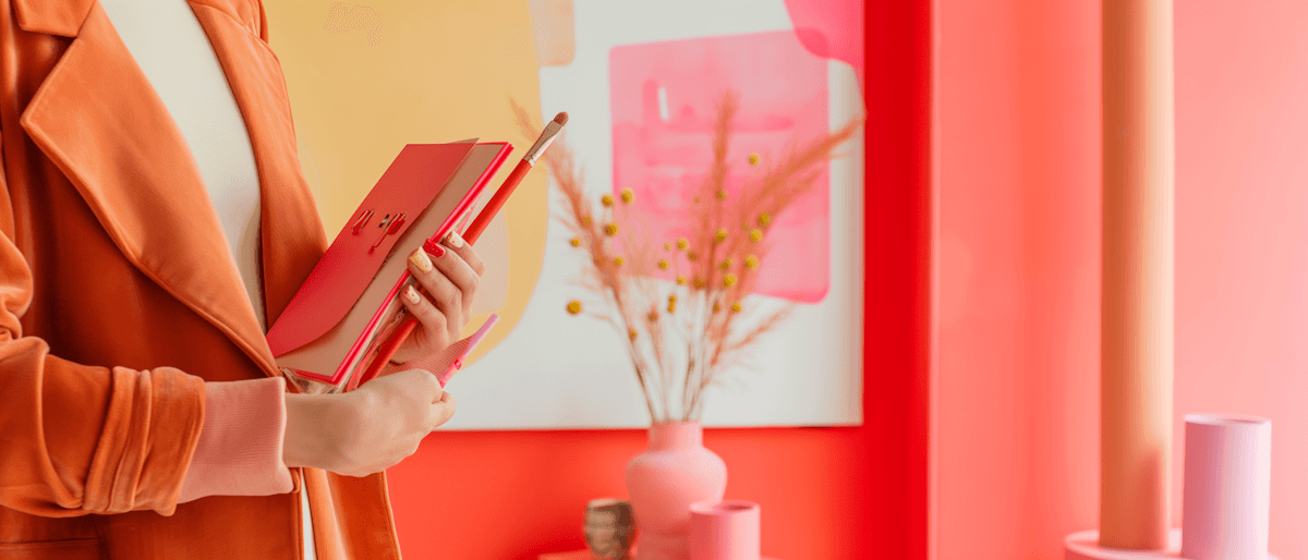 A woman holding a checklist in a bright colorful space