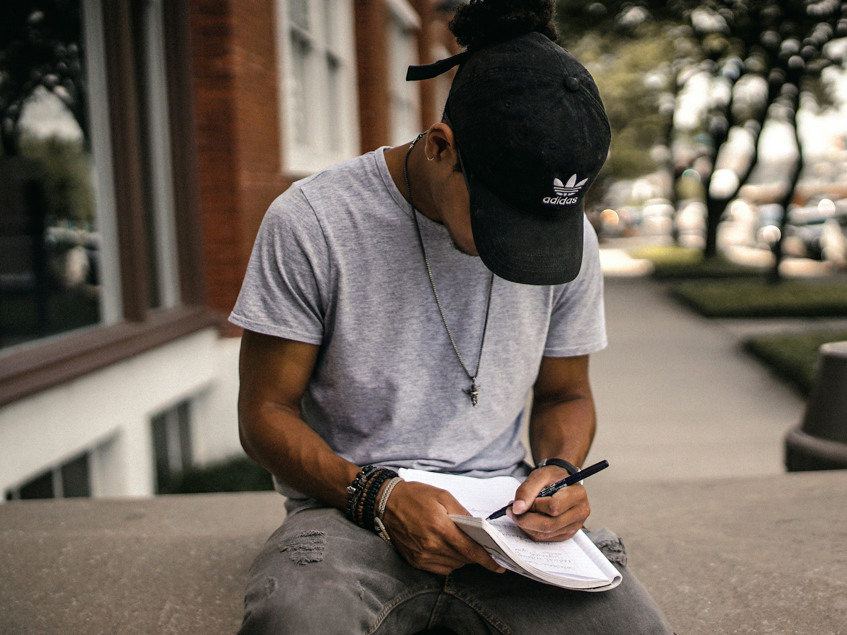 boy writing on a copy - AI Description Writer