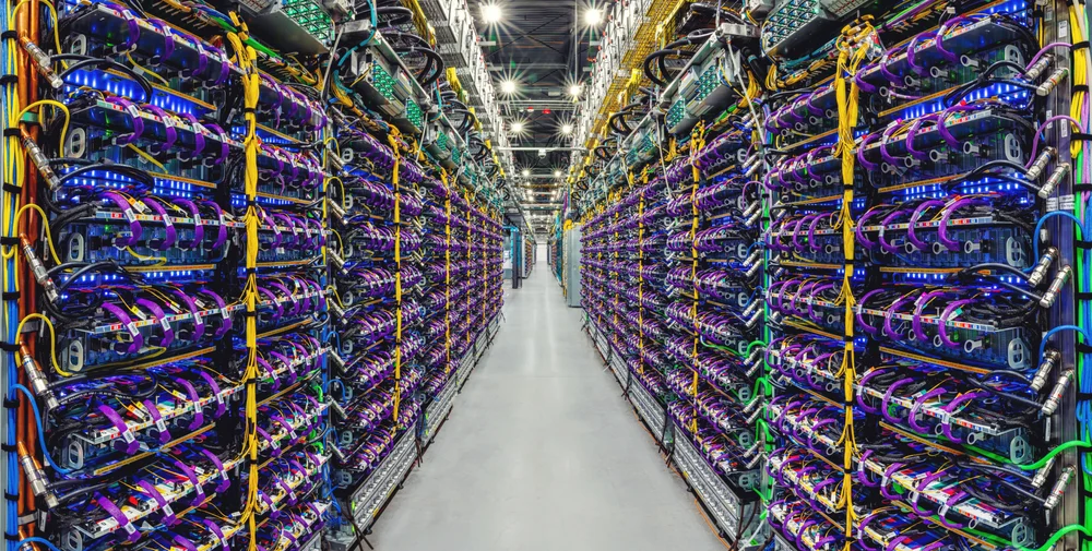 A row of Cloud TPU v5p AI accelerator supercomputers in a Google data center.
