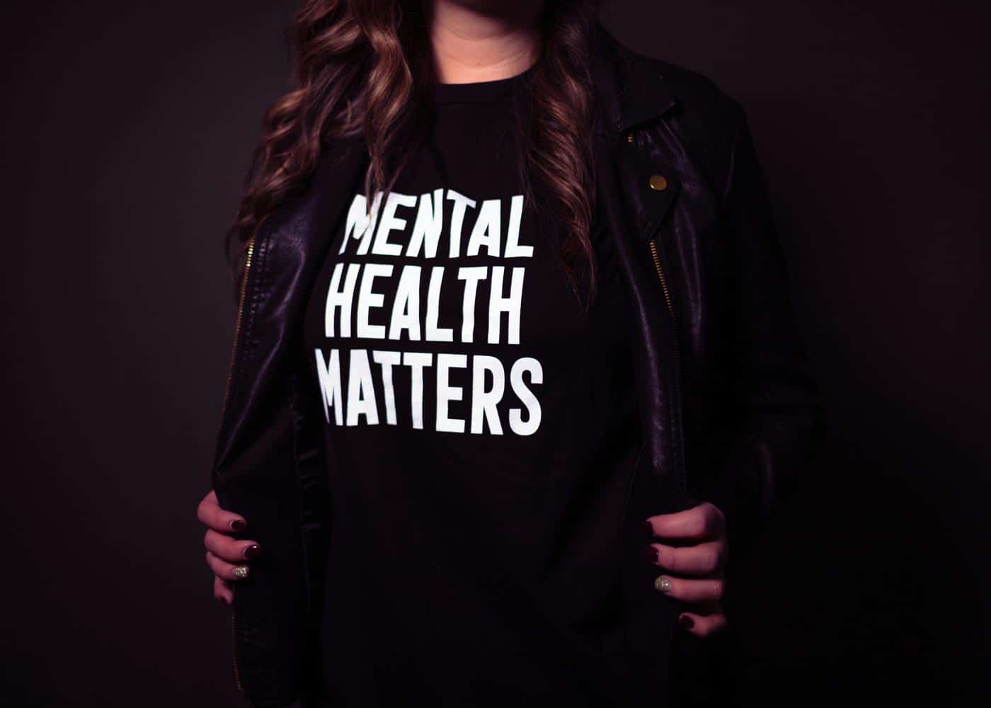 Mental and physical health - Woman wearing 'Mental Health Matters' shirt