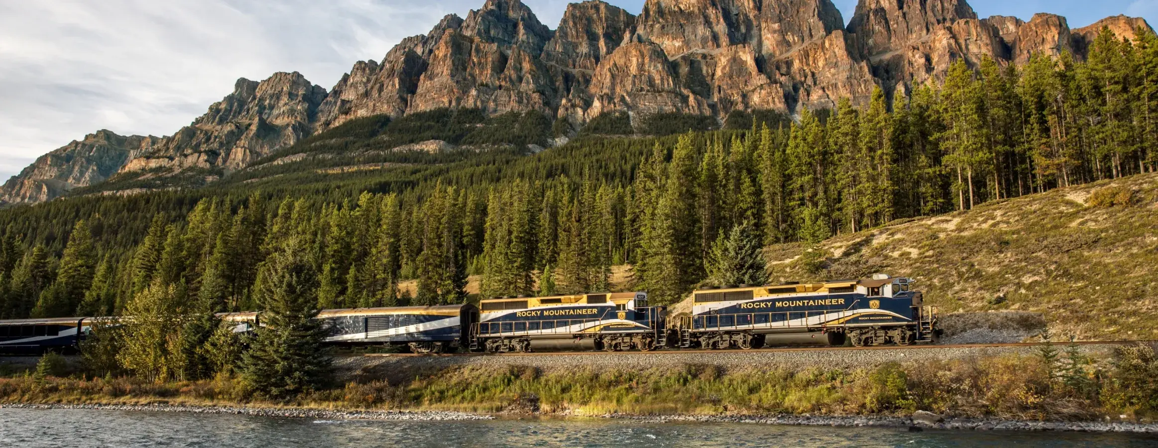 The Rocky Mountaineer train below Castle Mountain in Banff National Park, Alberta, on the First Passage to the West route