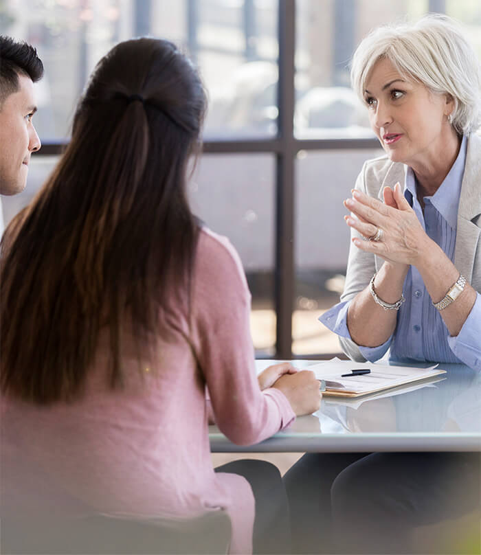 couple talking to doctor about financial options