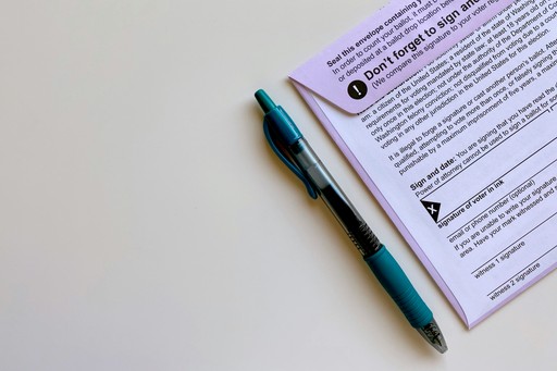 a pen sitting on top of a piece of paper illustrating the French Language Test Exemptions