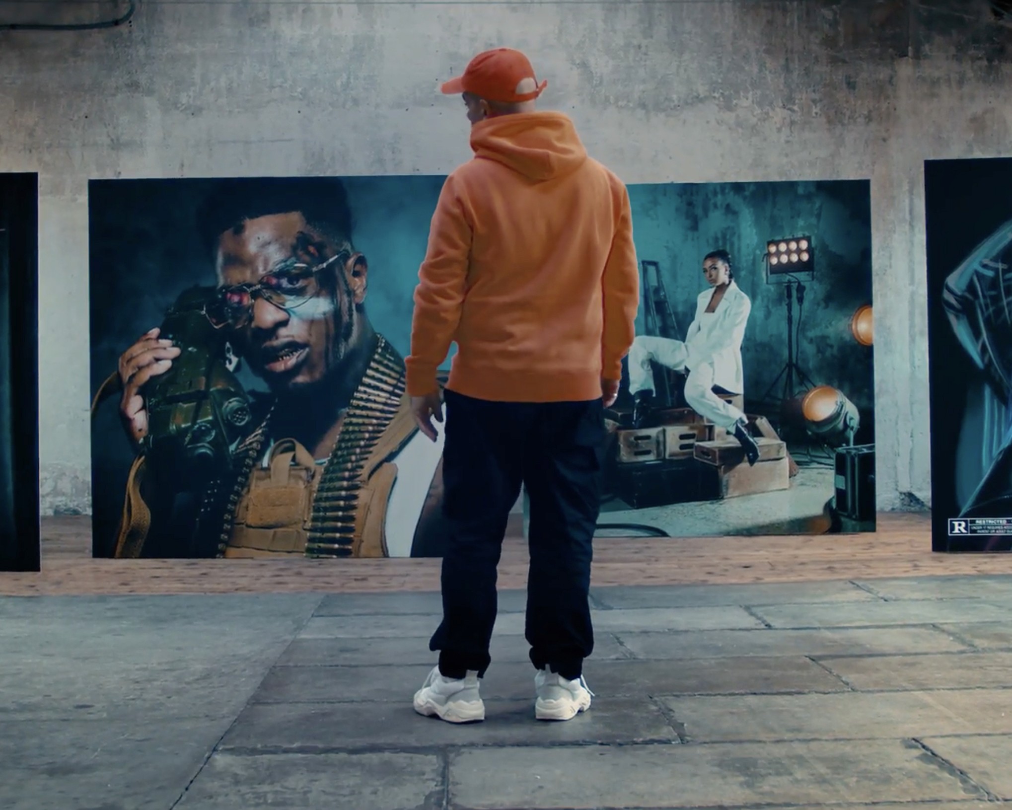 Koria in front of his work