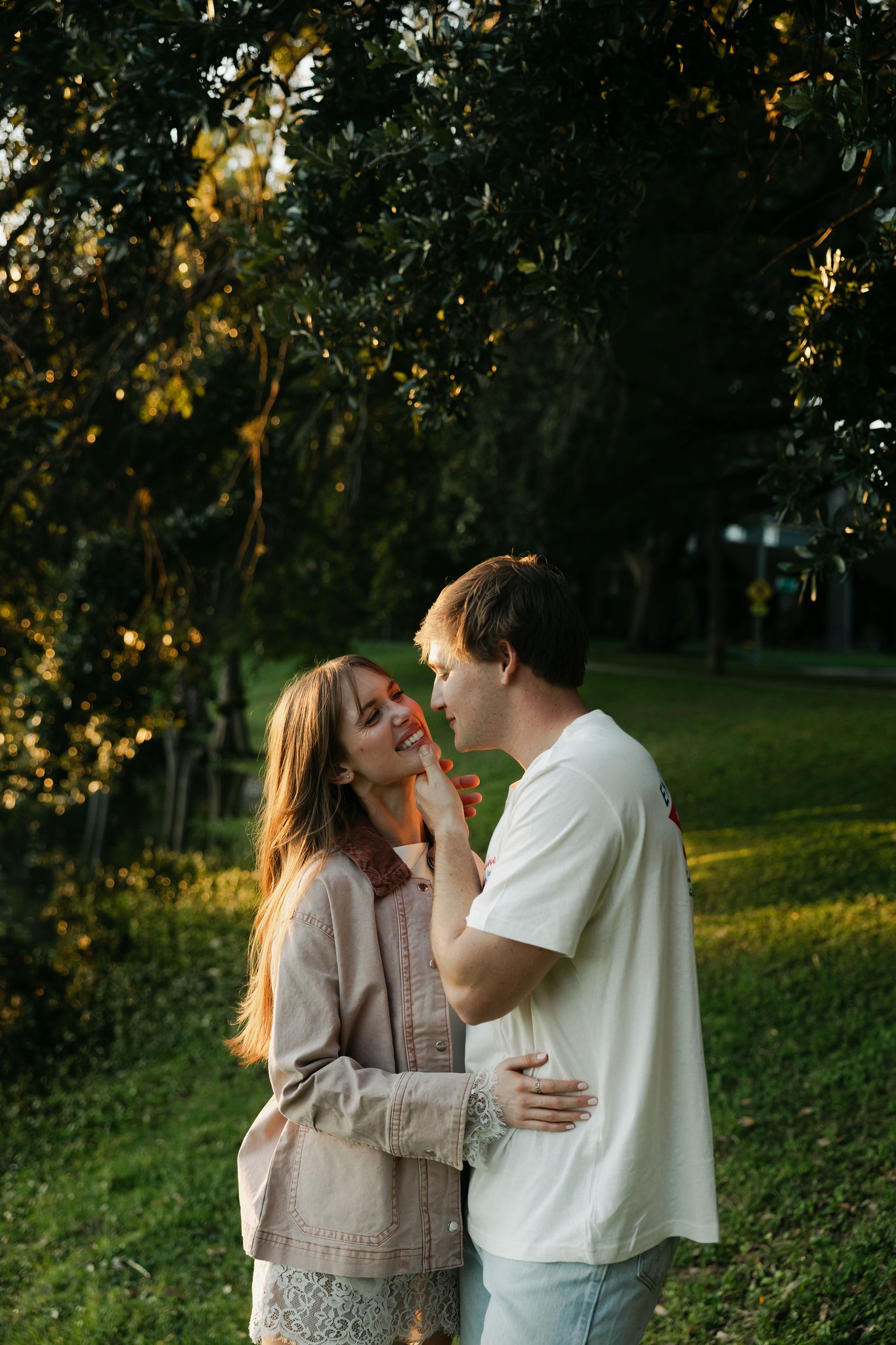     Wedding photographer South Florida captures a romantic couple portrait in golden evening light during an engagement session.