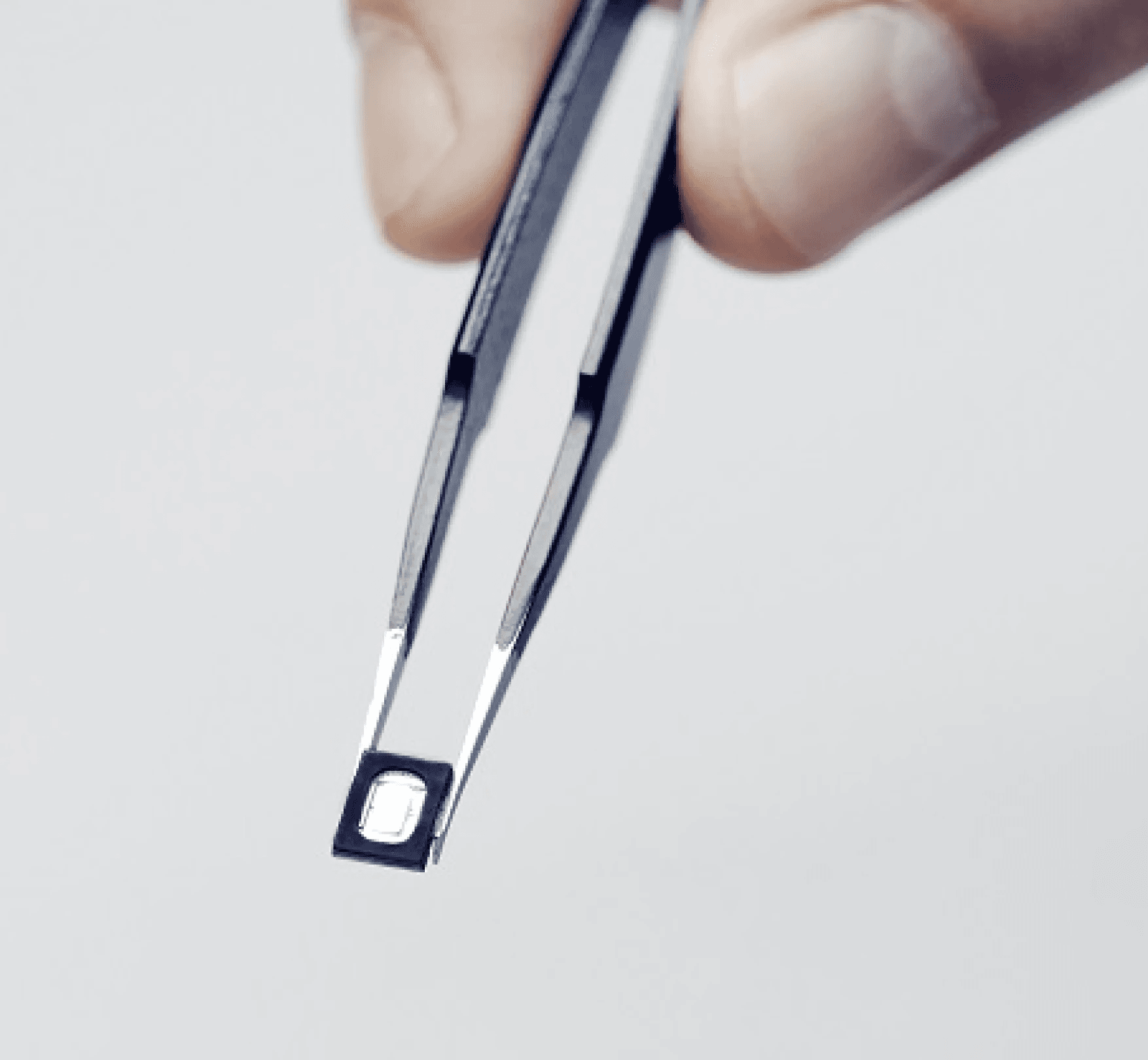 Tweasers holding USound MEMS speaker.