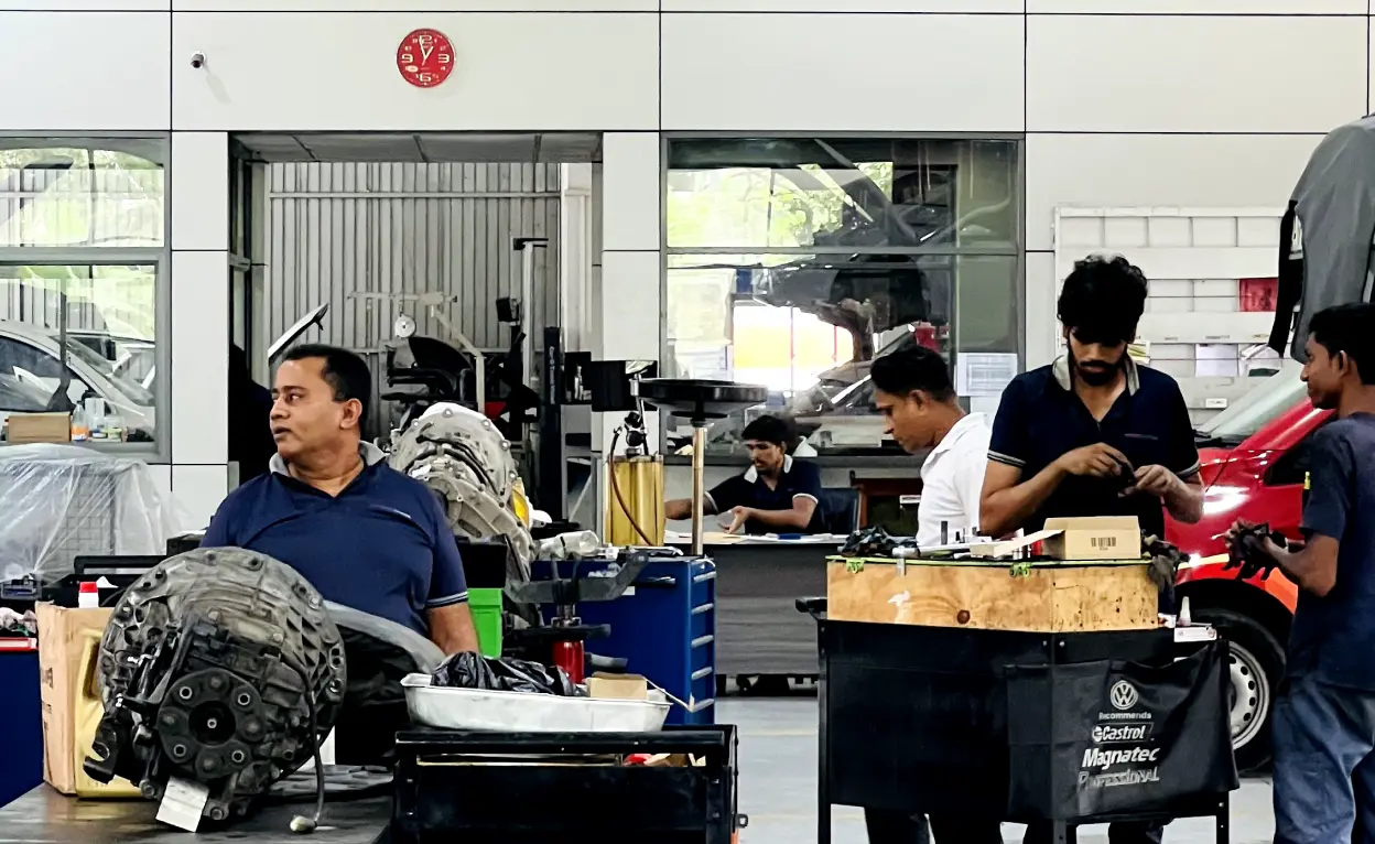 People at Ideal Premiier servicing cars