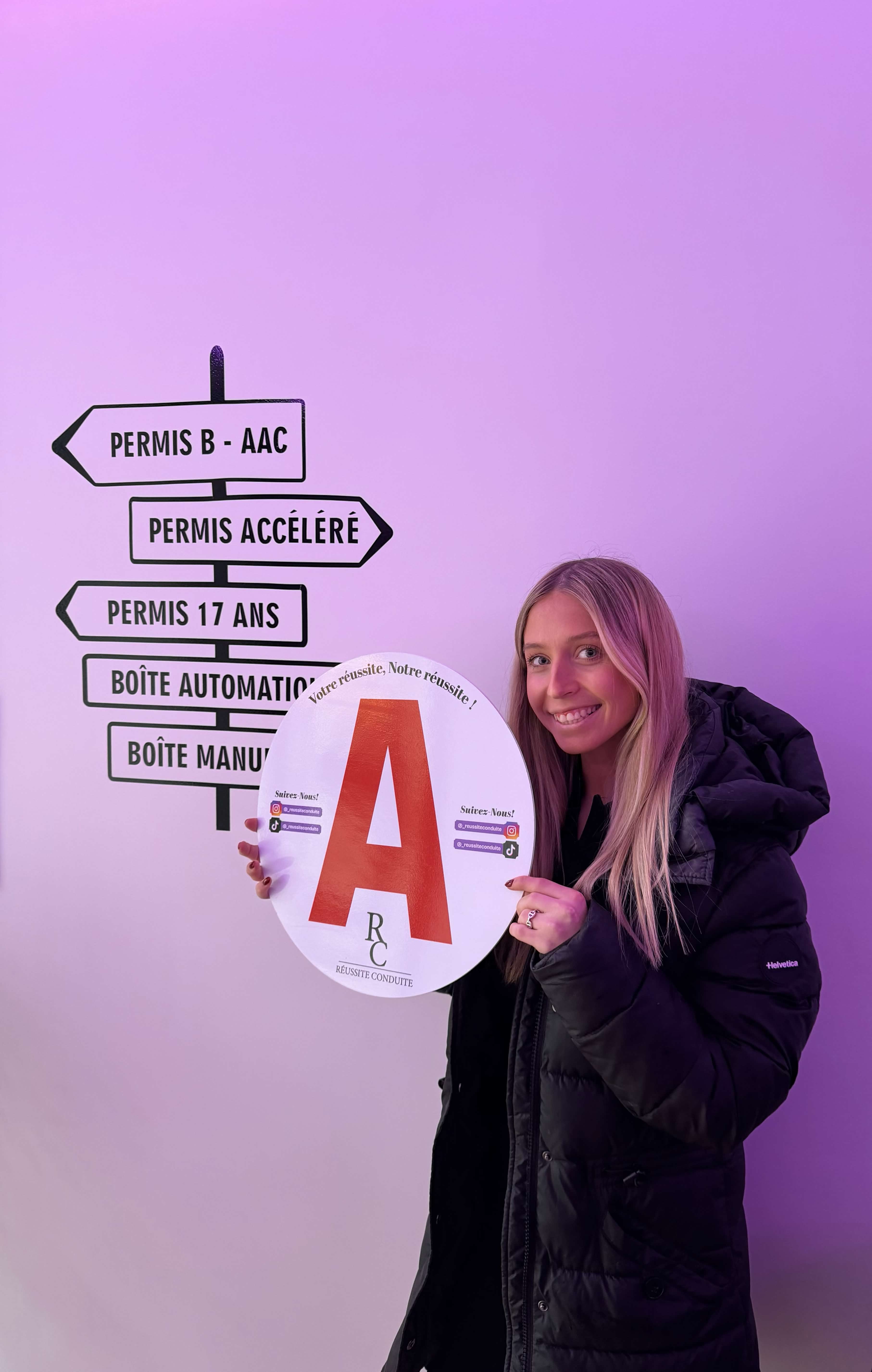man in black jacket holding blue tablet computer