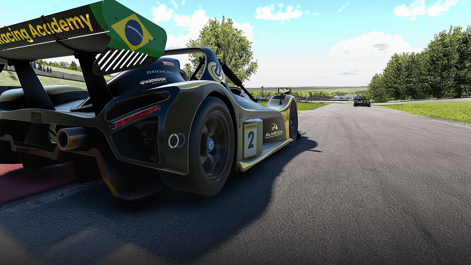 Rear shot of the Almeida Racing Academy SR10 on track with Kane Halliburton and Suellio Almeida driving.