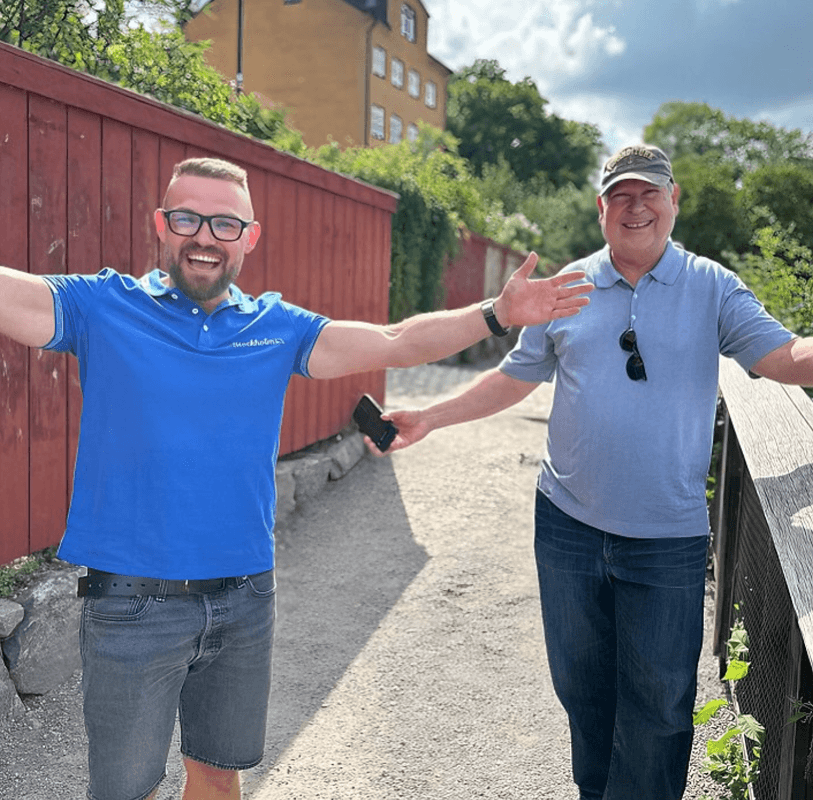 Tourists exploring Stockholm during private electric sightseeing cart tour
