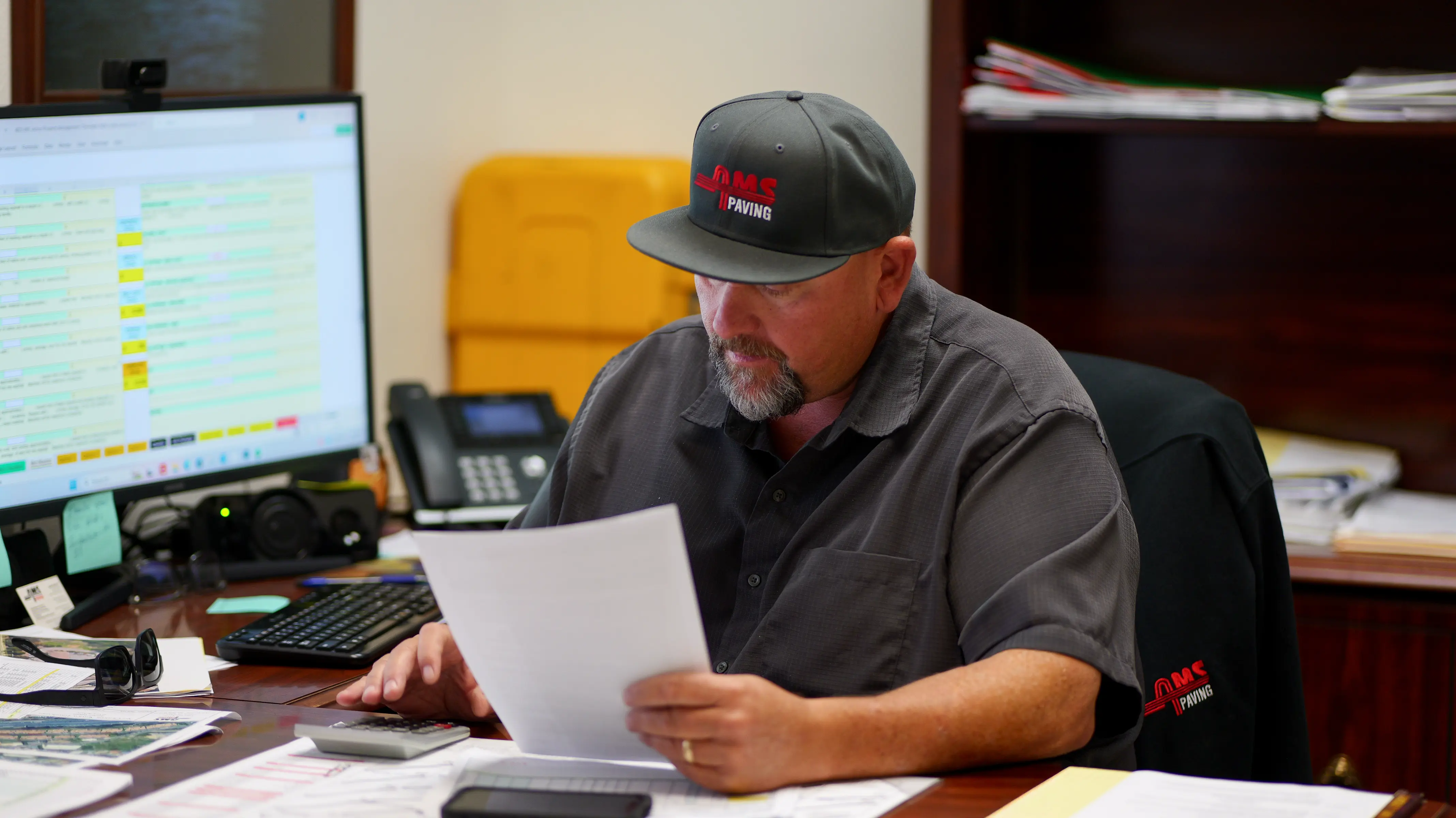 Estimator sales account rep working up a price estimate