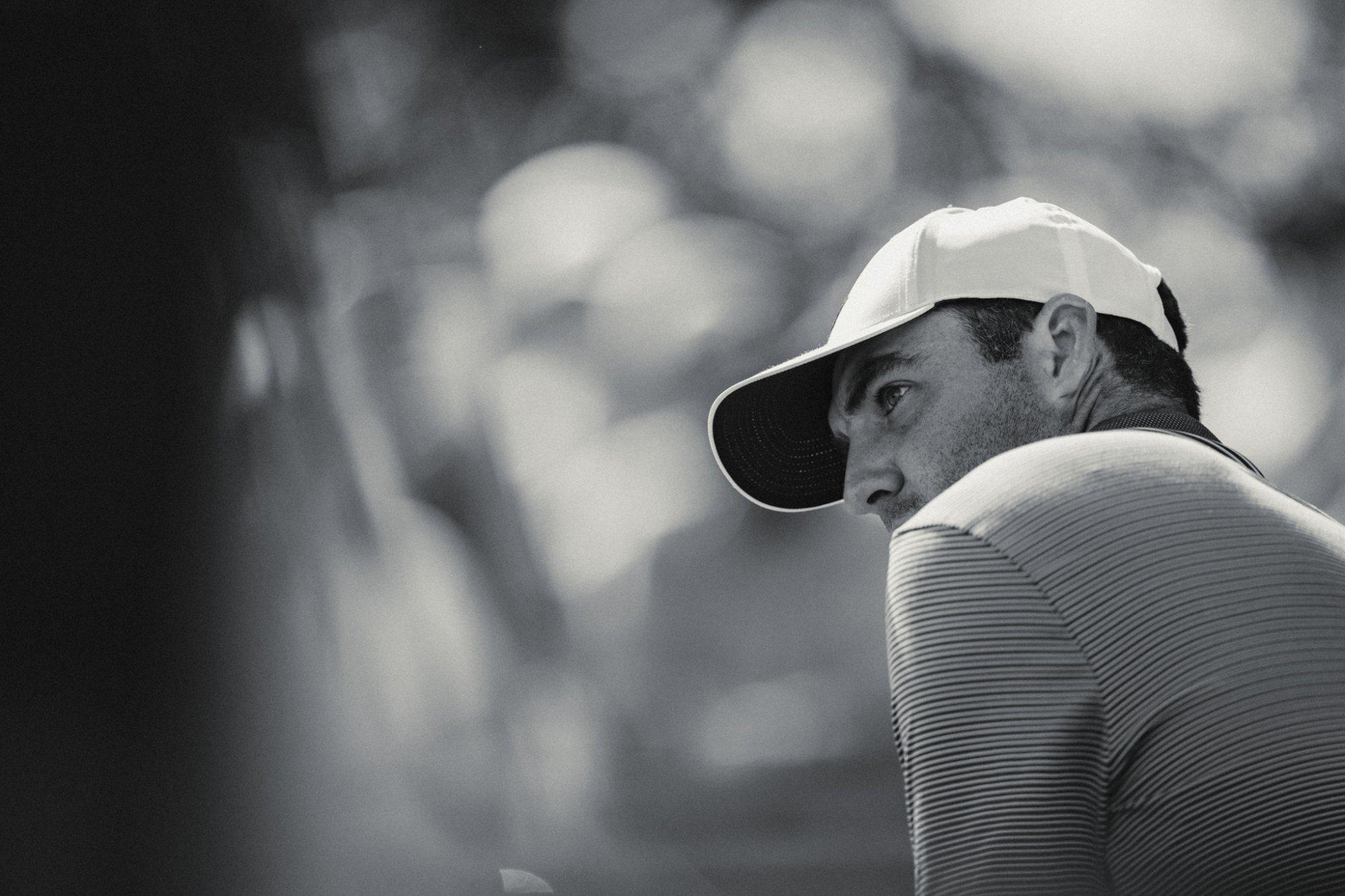 A black and white side profile of a man looking to the left