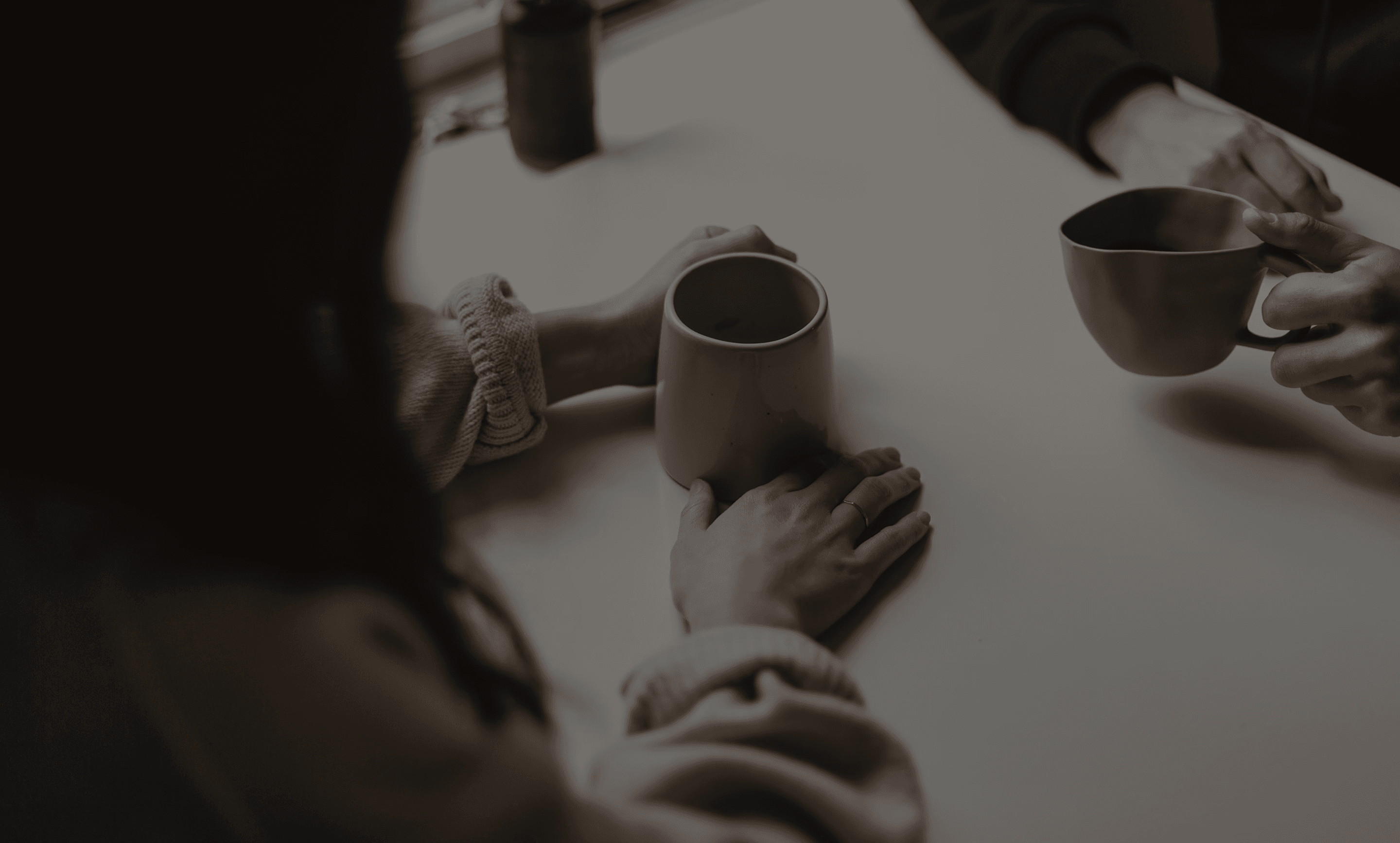 Hero image – hands and coffee cup