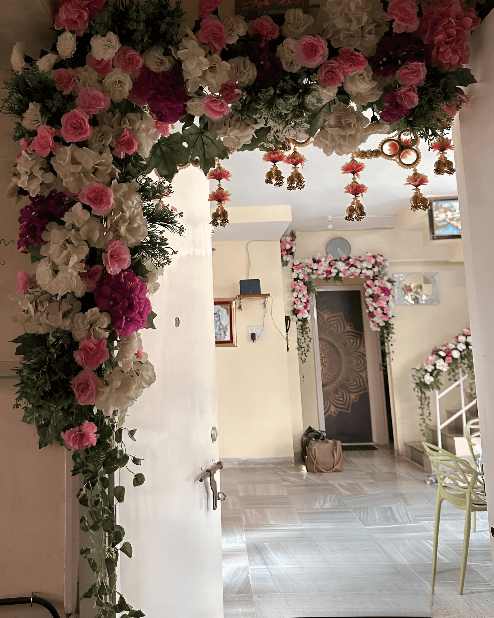 Wedding home entrance decorated with pink, purple & white flowers arch, perfect for engagement or indoor entrance decoration