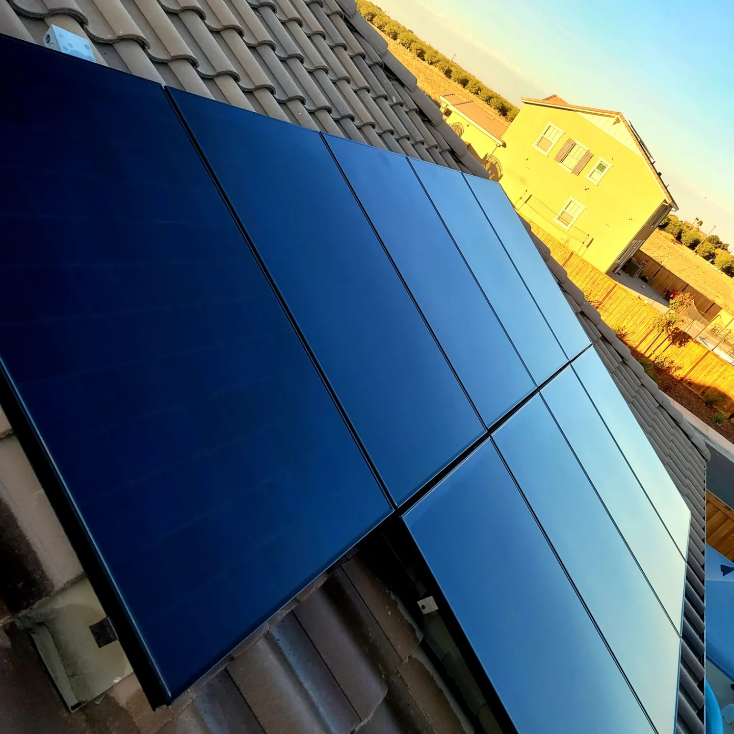 Glossy clean solar panels in low sun | Premier Solar Service
