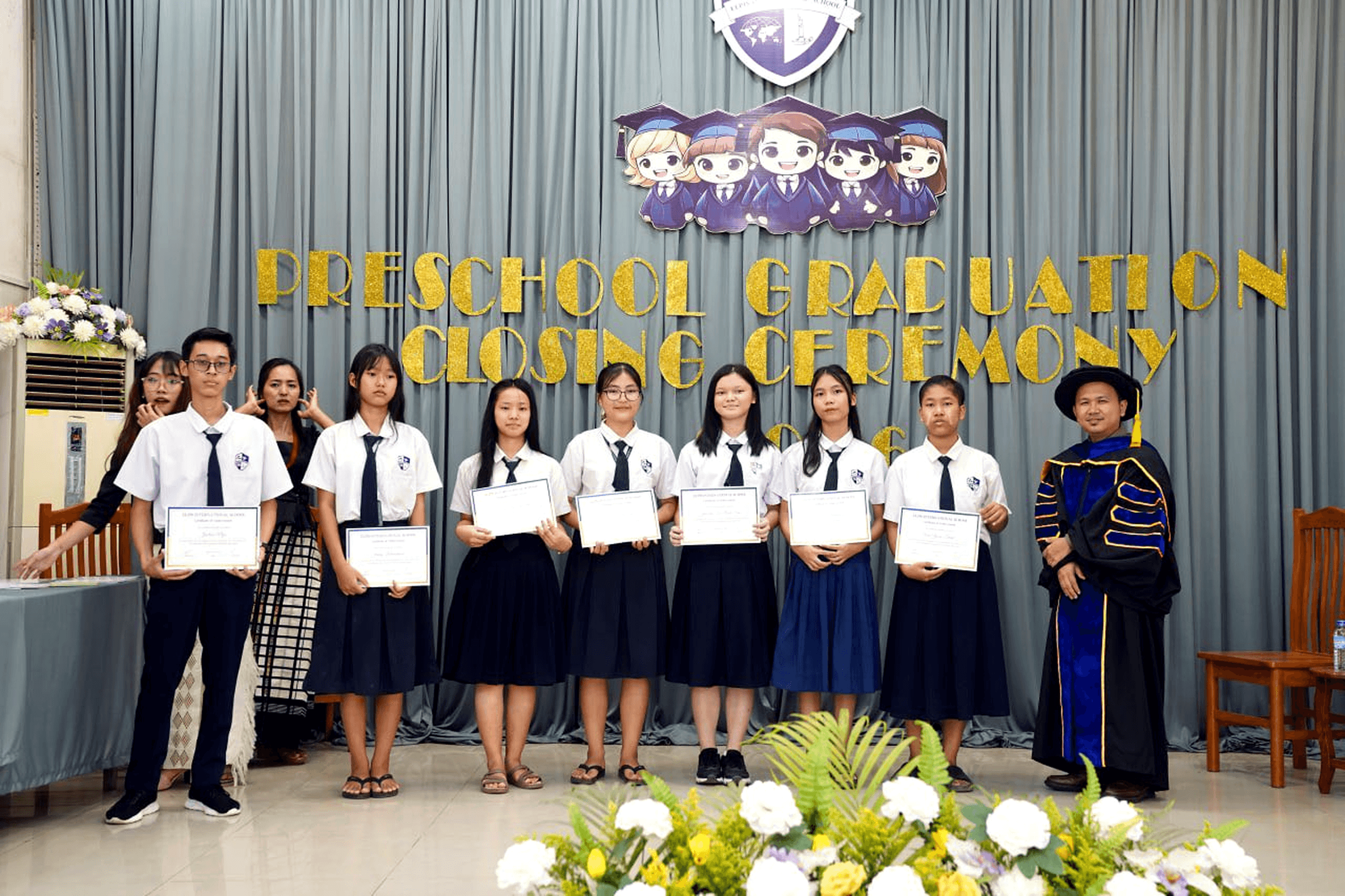 Middle school students at Elpis International School receiving certificates during a school ceremony in Yangon, Myanmar