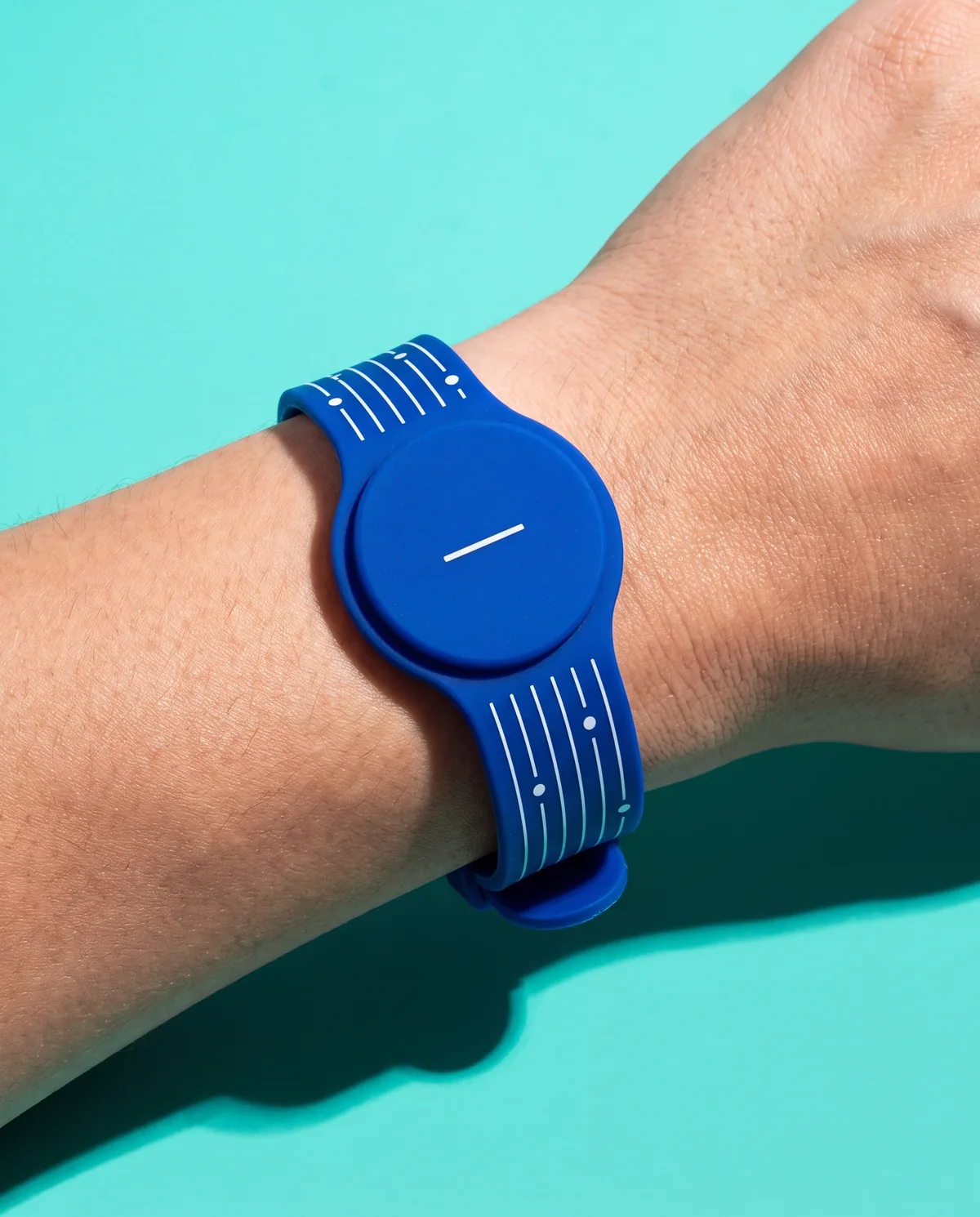 Blue RFID silicone wristband with proximity tag, worn on the wrist