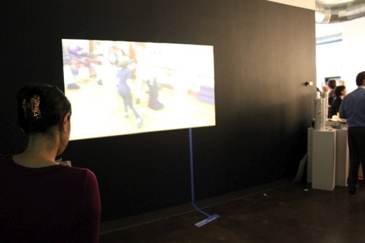 overview of a video presentation projected on a wall in the exhibition room