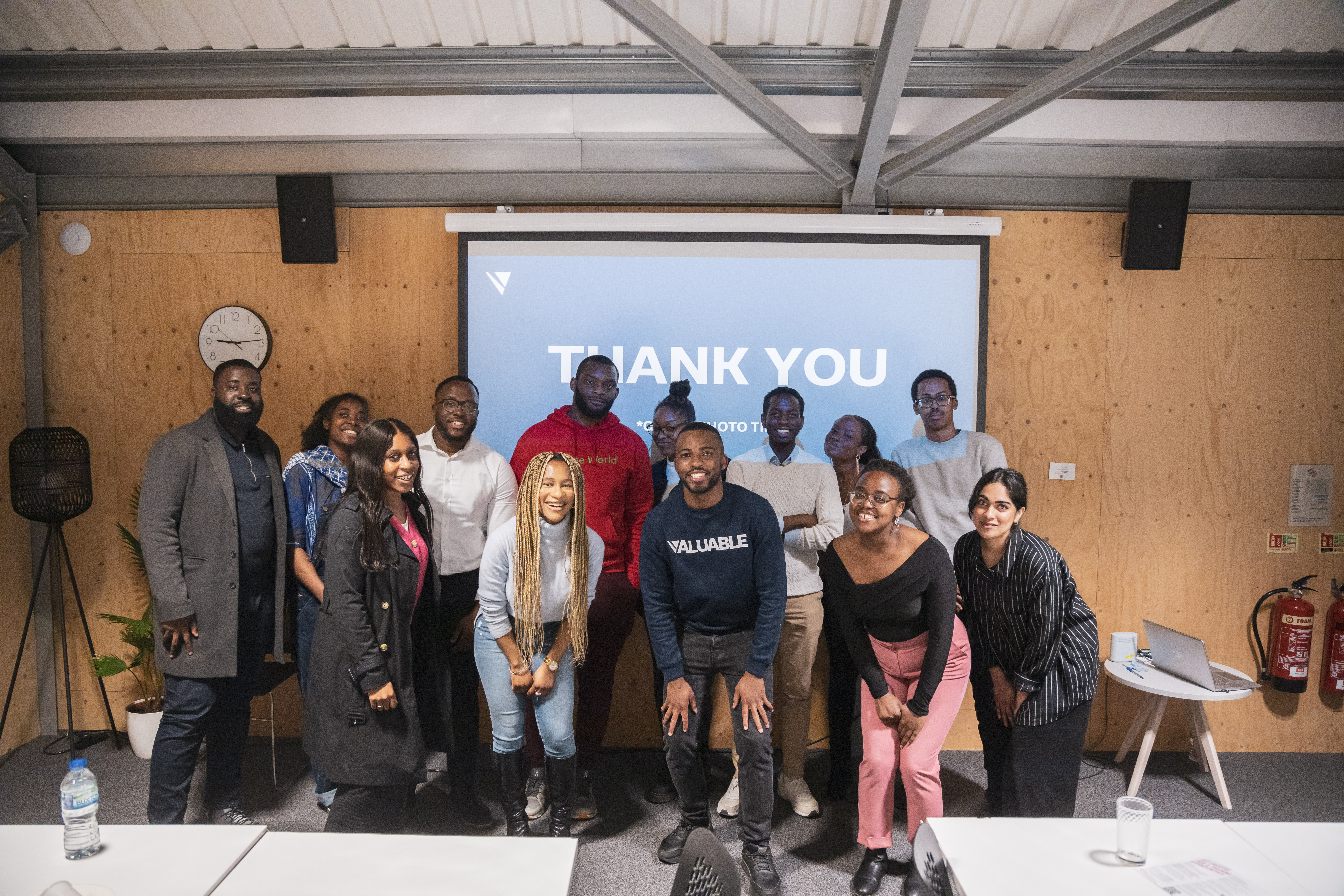 Group of diverse young people posing for a photo in Valuable the public speaking workshop.