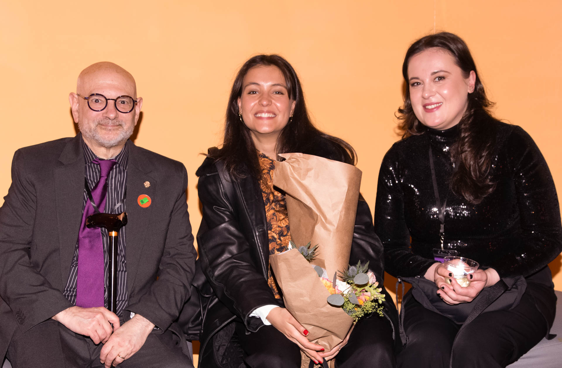 a group of students smiling for the camera in the SVA Theatre lobby after the Venture Forum