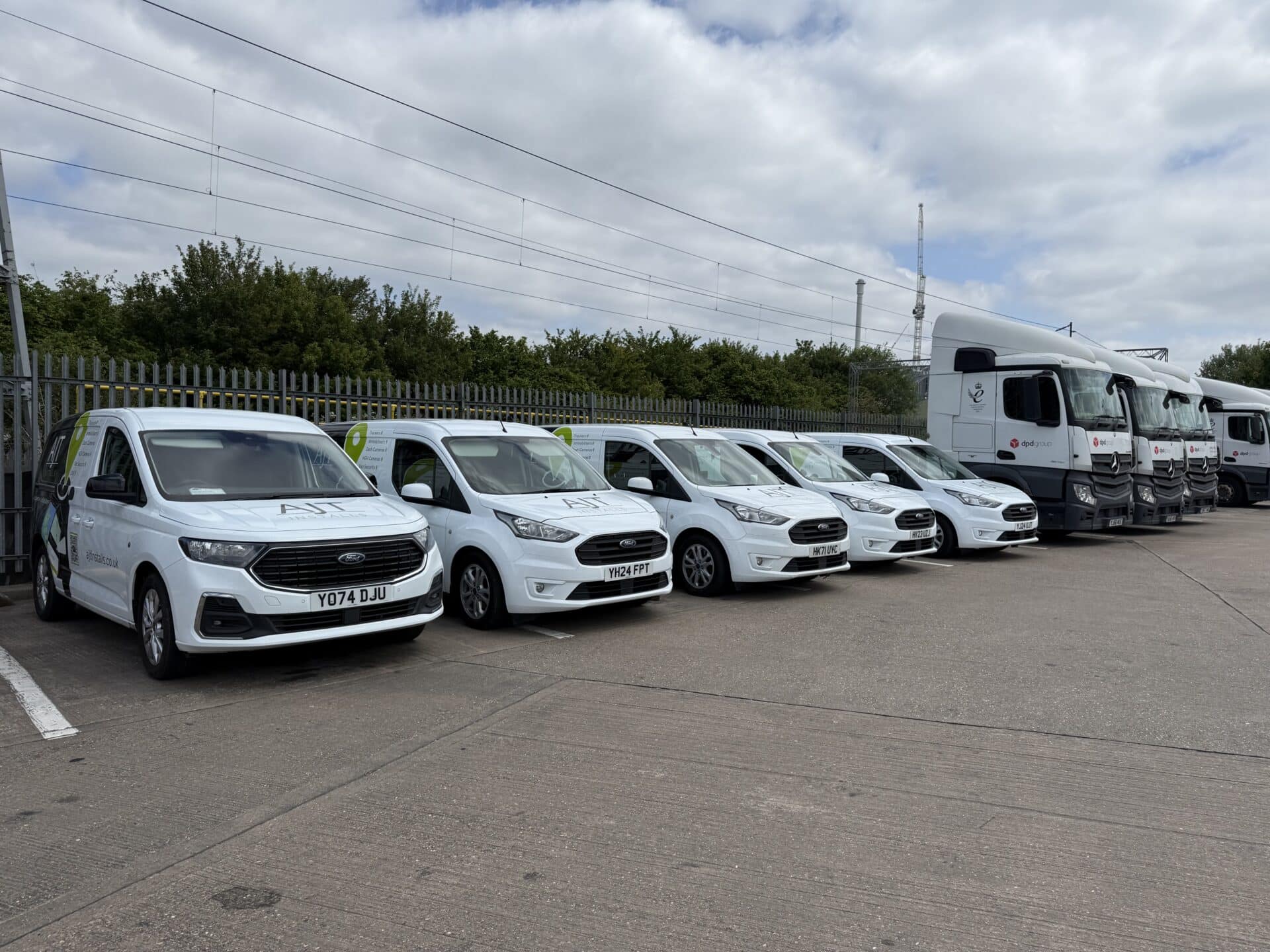 Commercial fleet vehicles at a customer depot