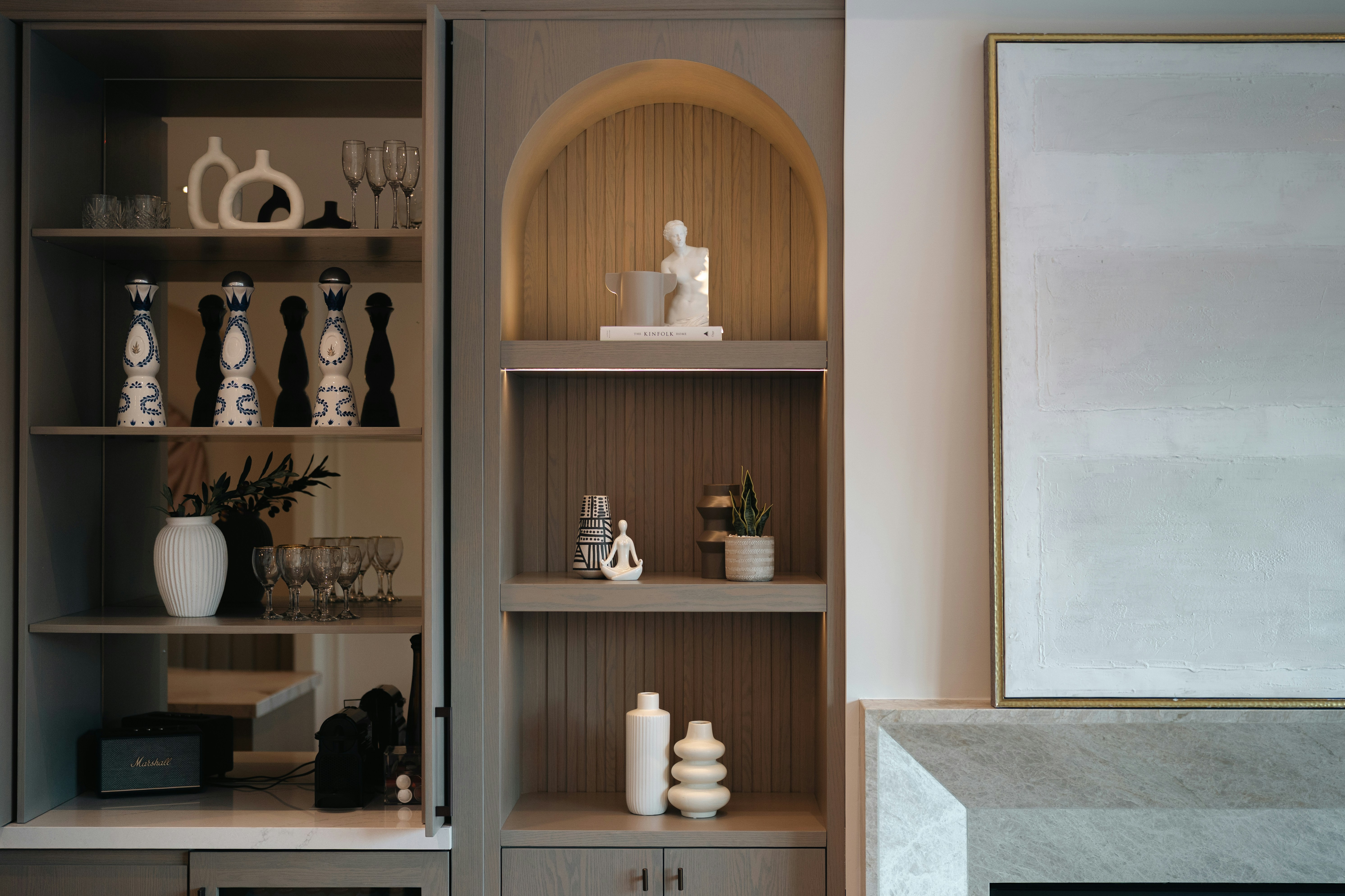 Modern shelving unit with decorative objects and vases