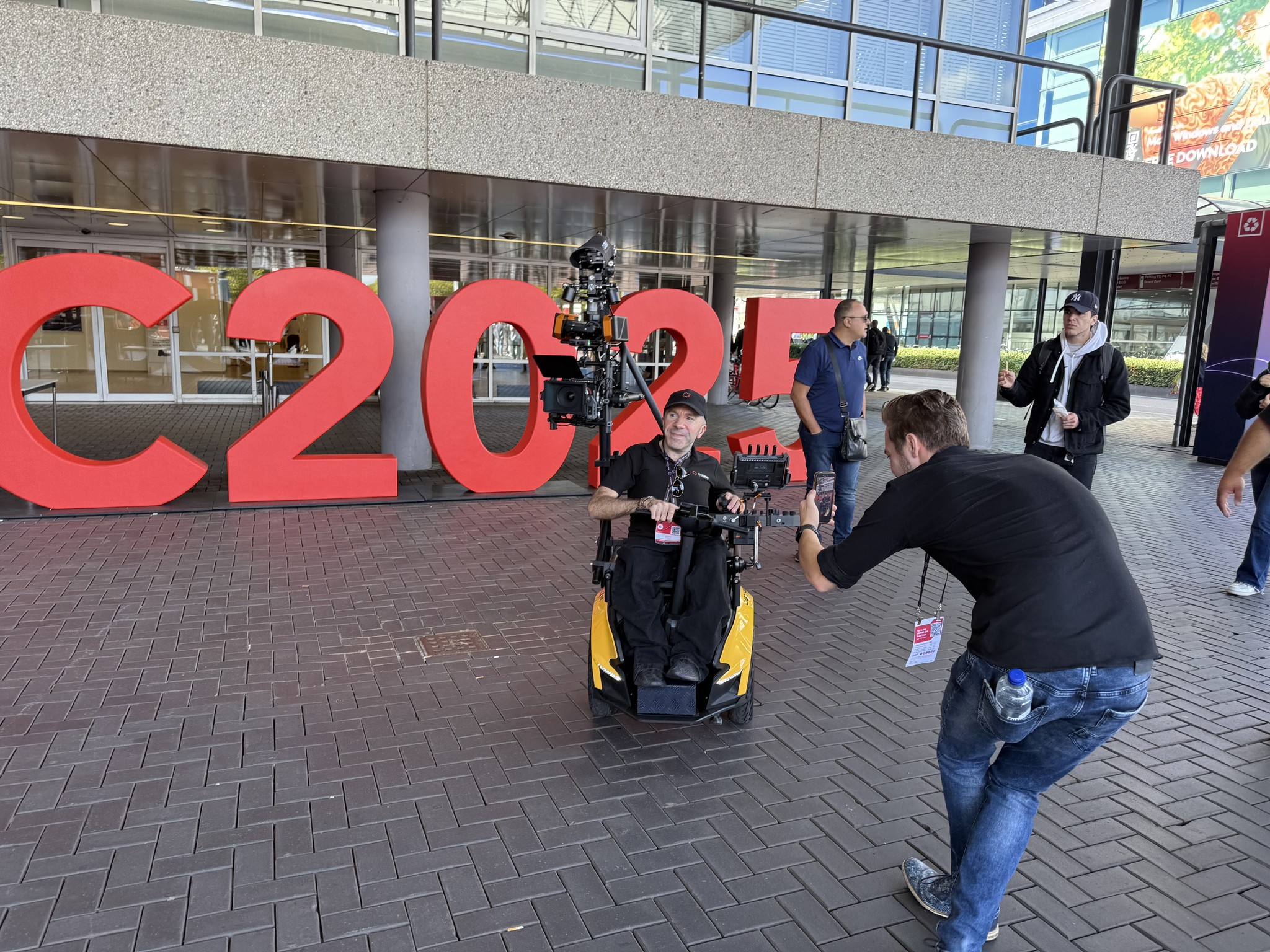 Image of CAERUS getting attention outside RAI in Amsterdam in front of IBC2025 sign