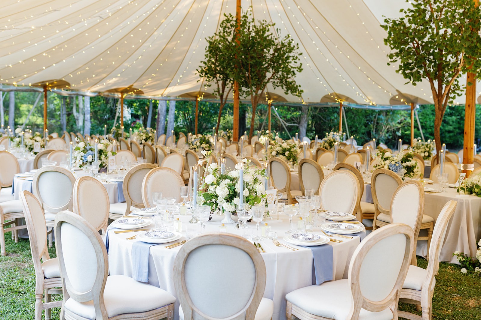 Outdoor table setting under a marquee