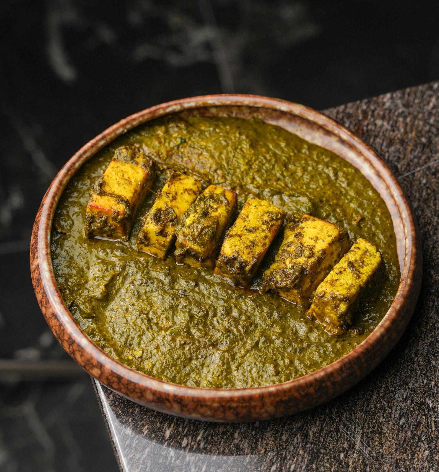 Creamy saag paneer made with fresh spinach and cottage cheese at Dhoom Indian restaurant Greektown Toronto