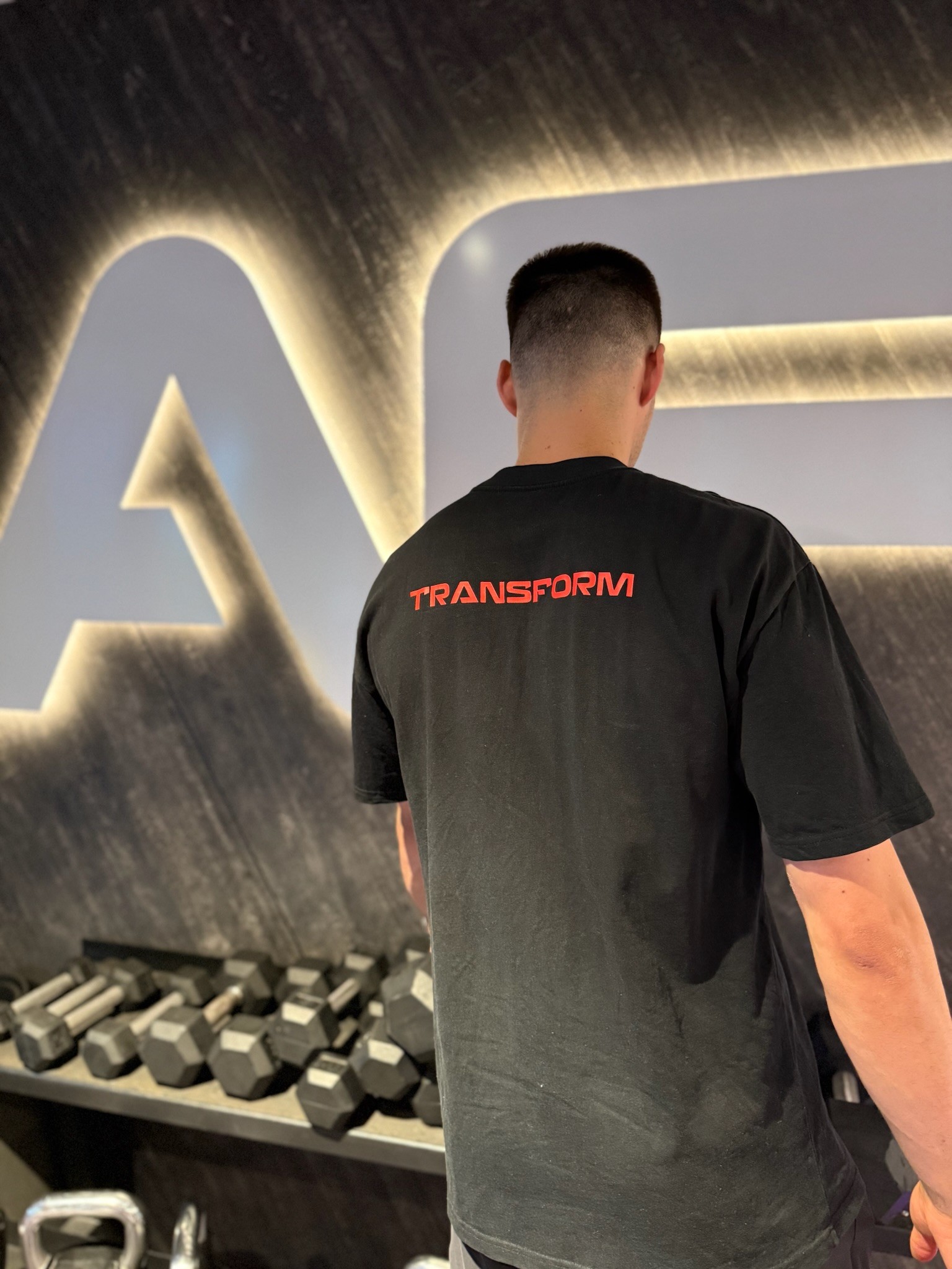 Rachel Stone standing with ABS and hands in her pockets