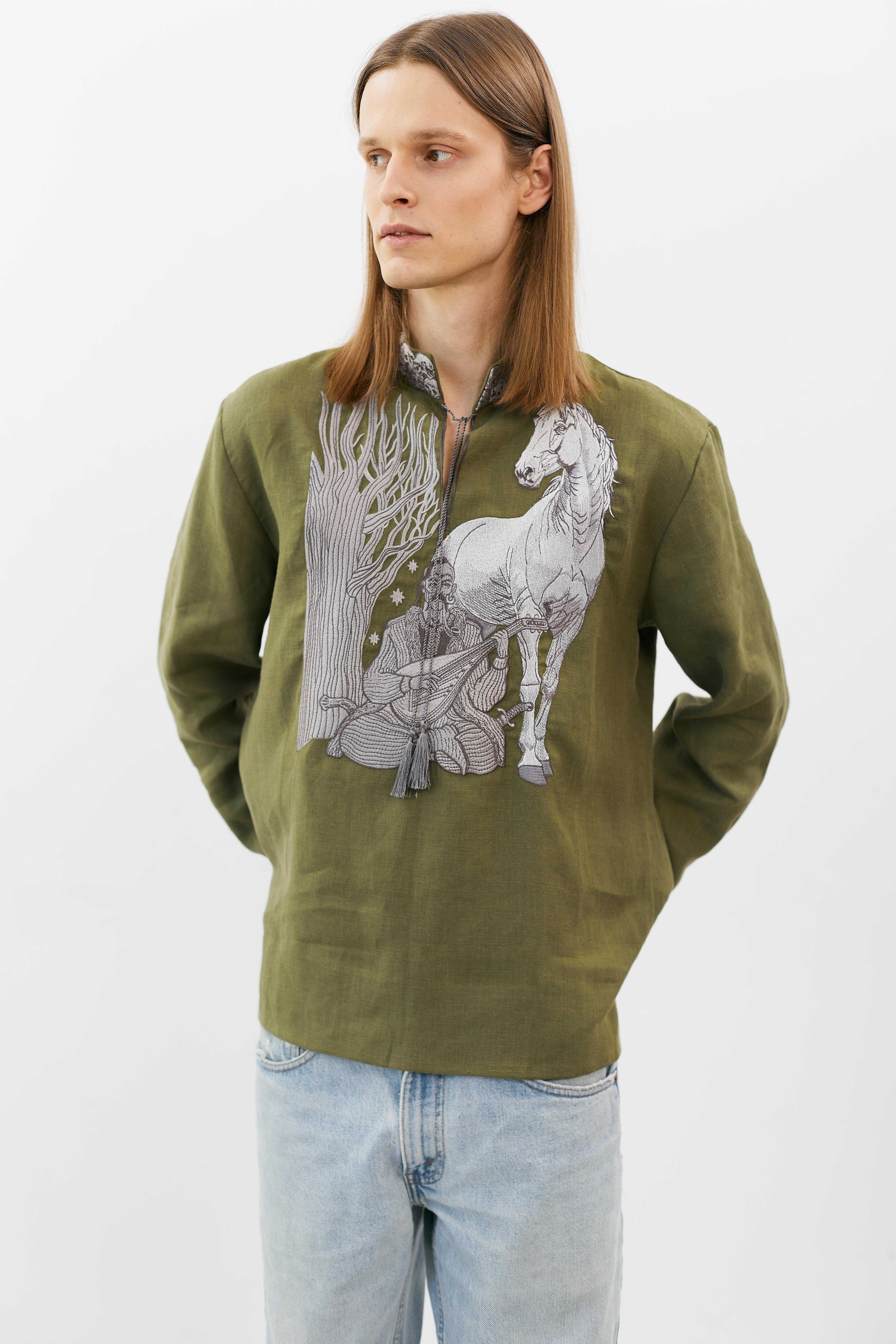 Woman wearing cherry-red drop earrings against a warm golden backdrop