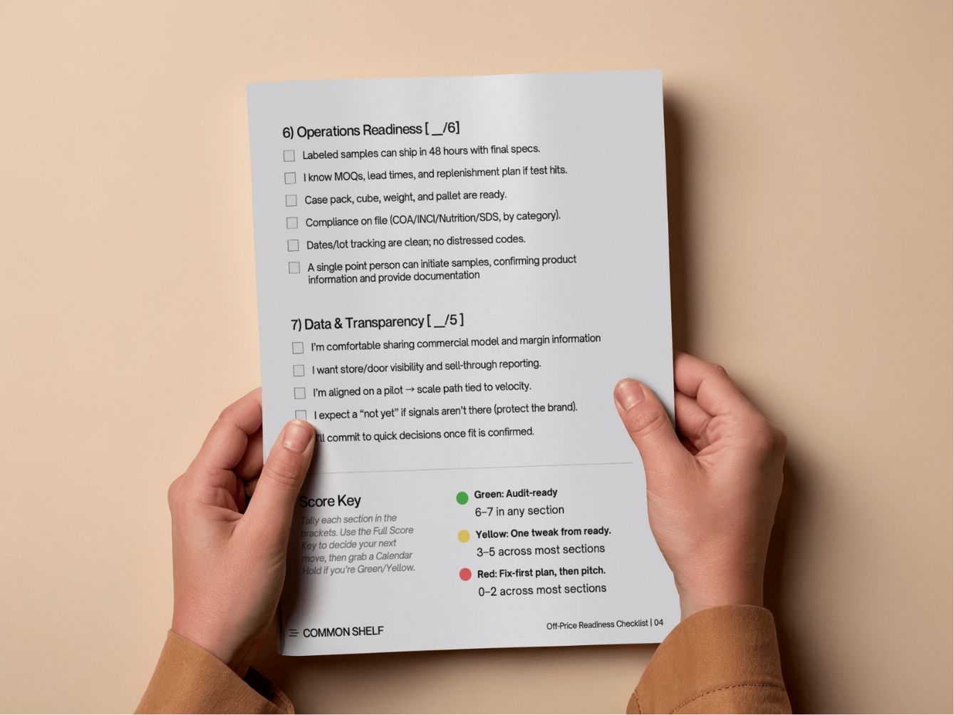 A basketball player in mid-air against a clear blue sky, reaching for a dunk.