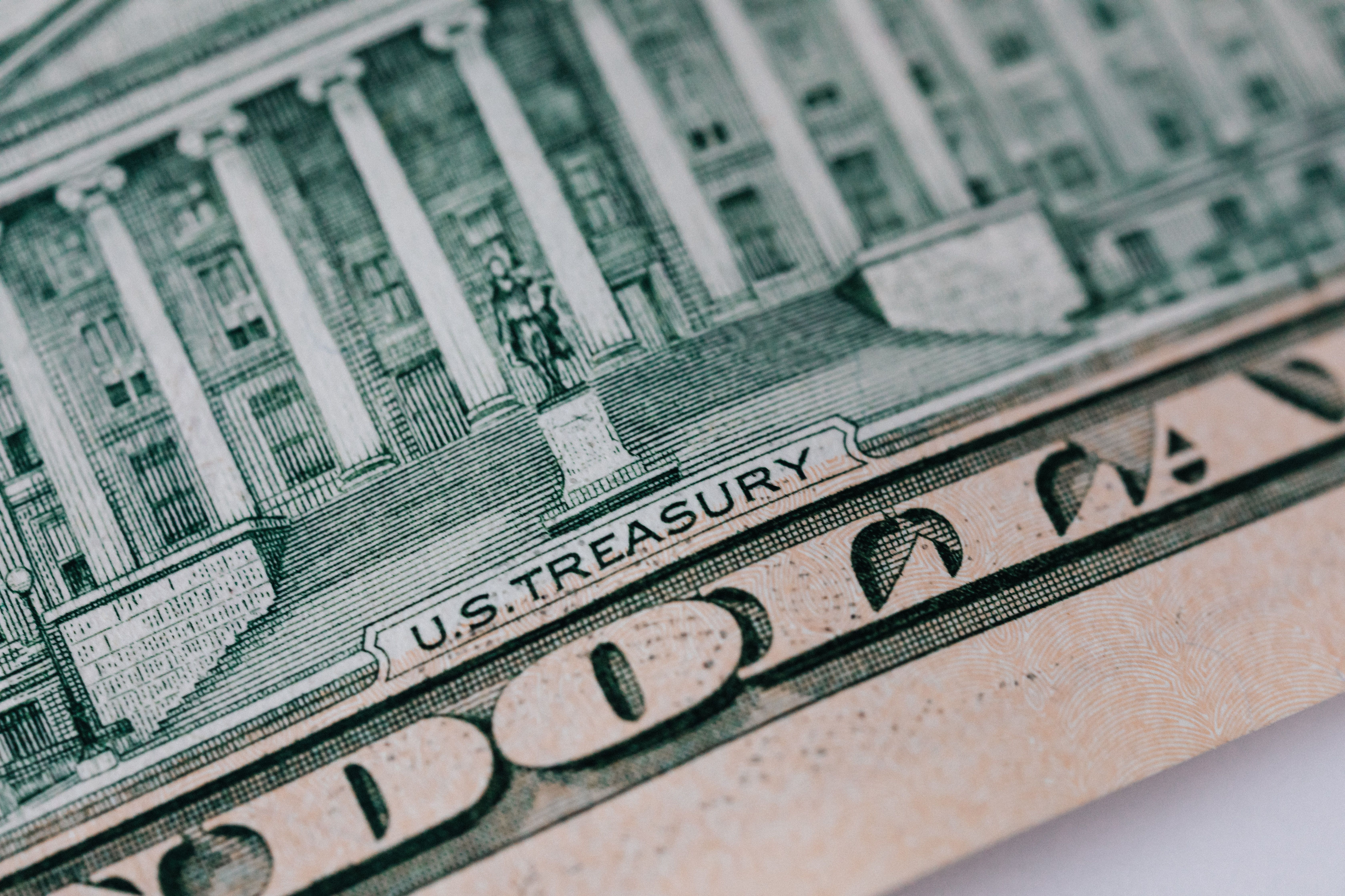 from-above-ten-dollar-banknote-with-inscription-and-united-states-treasury-build - www.kaboompics.com (pexels)