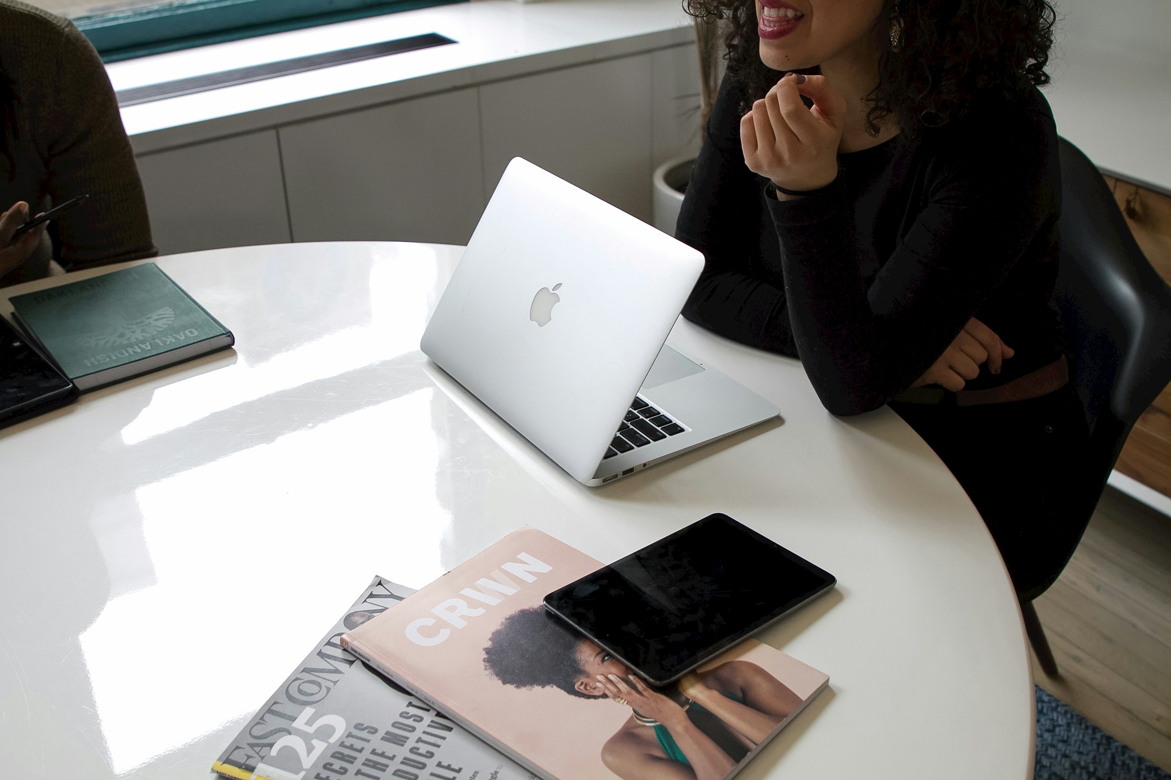 woman sitting alone in meeting - Shopify Store Design