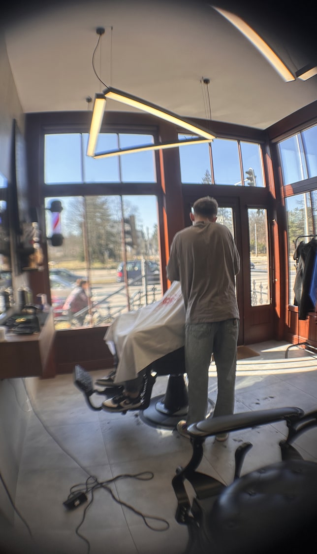 Cocktail sitting on set table next to plate of olives