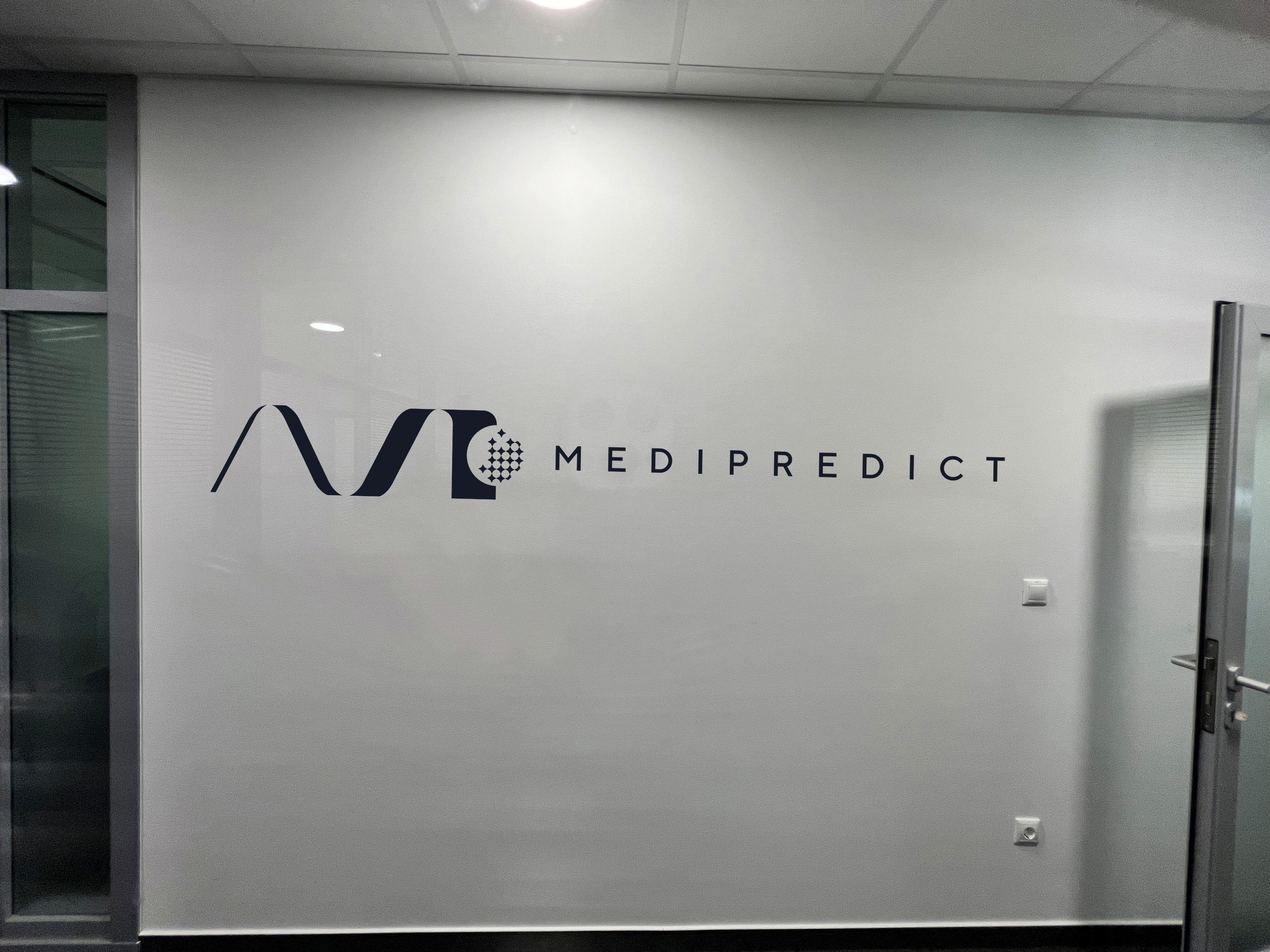 MEDIPREDICT logo on a wall.