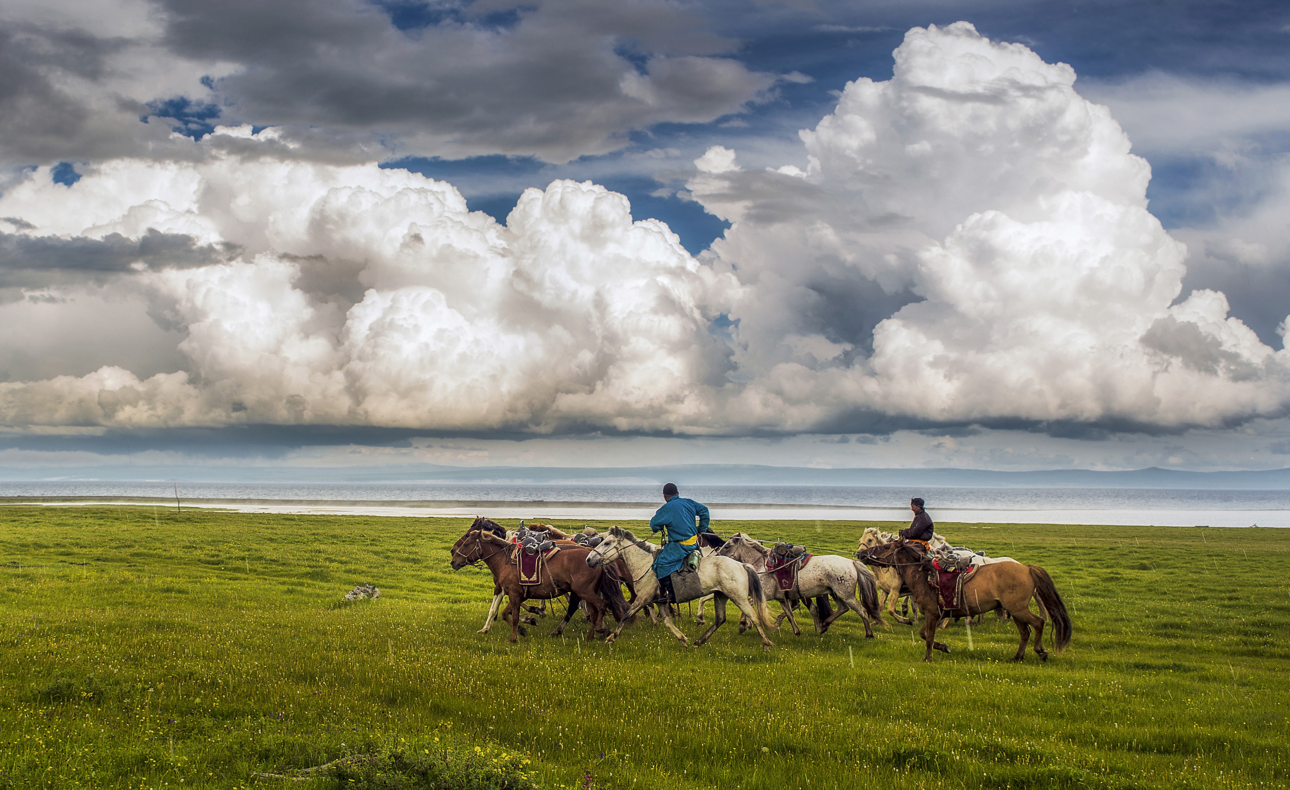a bridge over a body of water with a statue on top